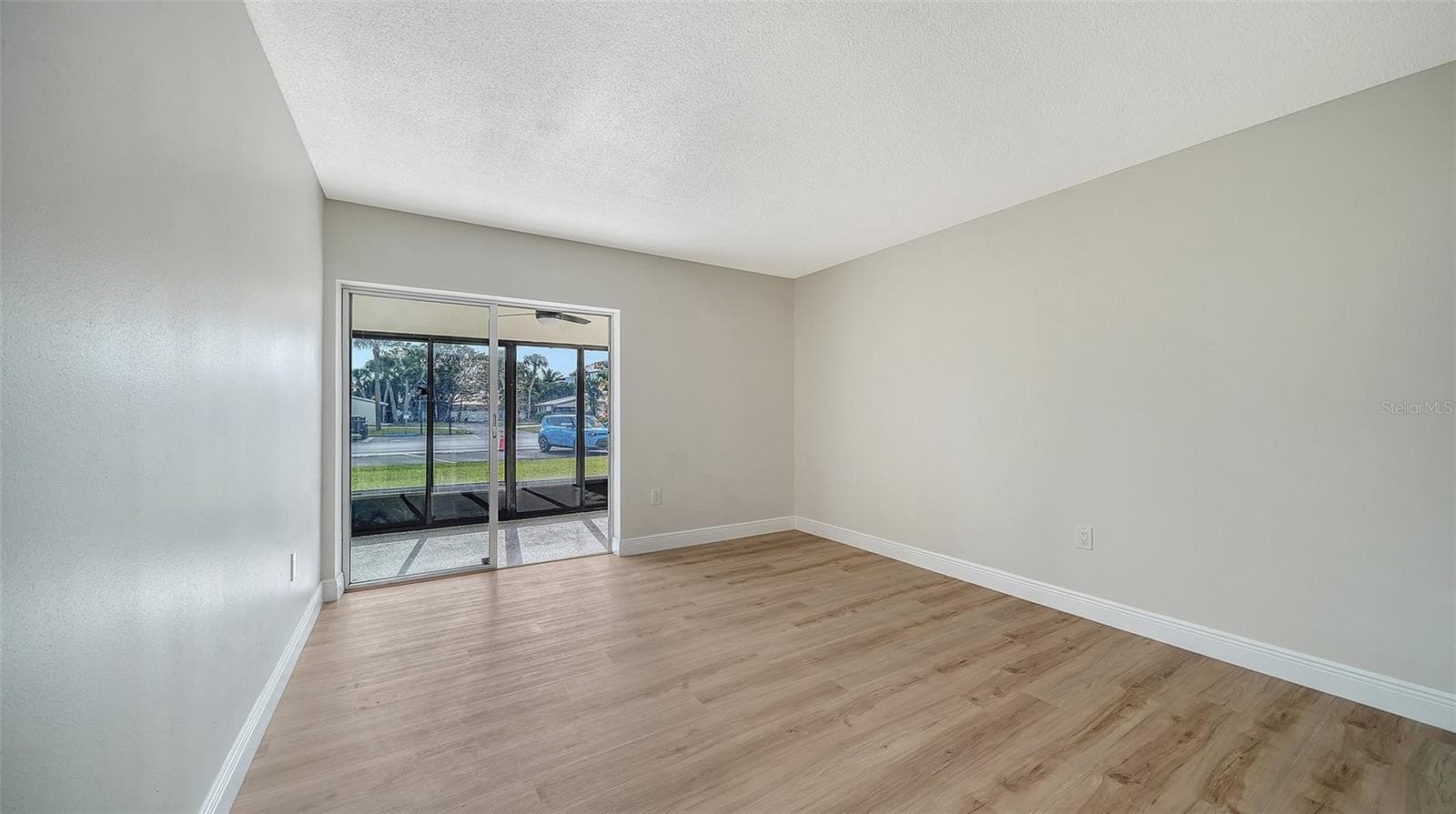 Guest Bedroom, also with sliders leading to Lanai #2. - 101 WHISPERING SANDS DR #107, SARASOTA