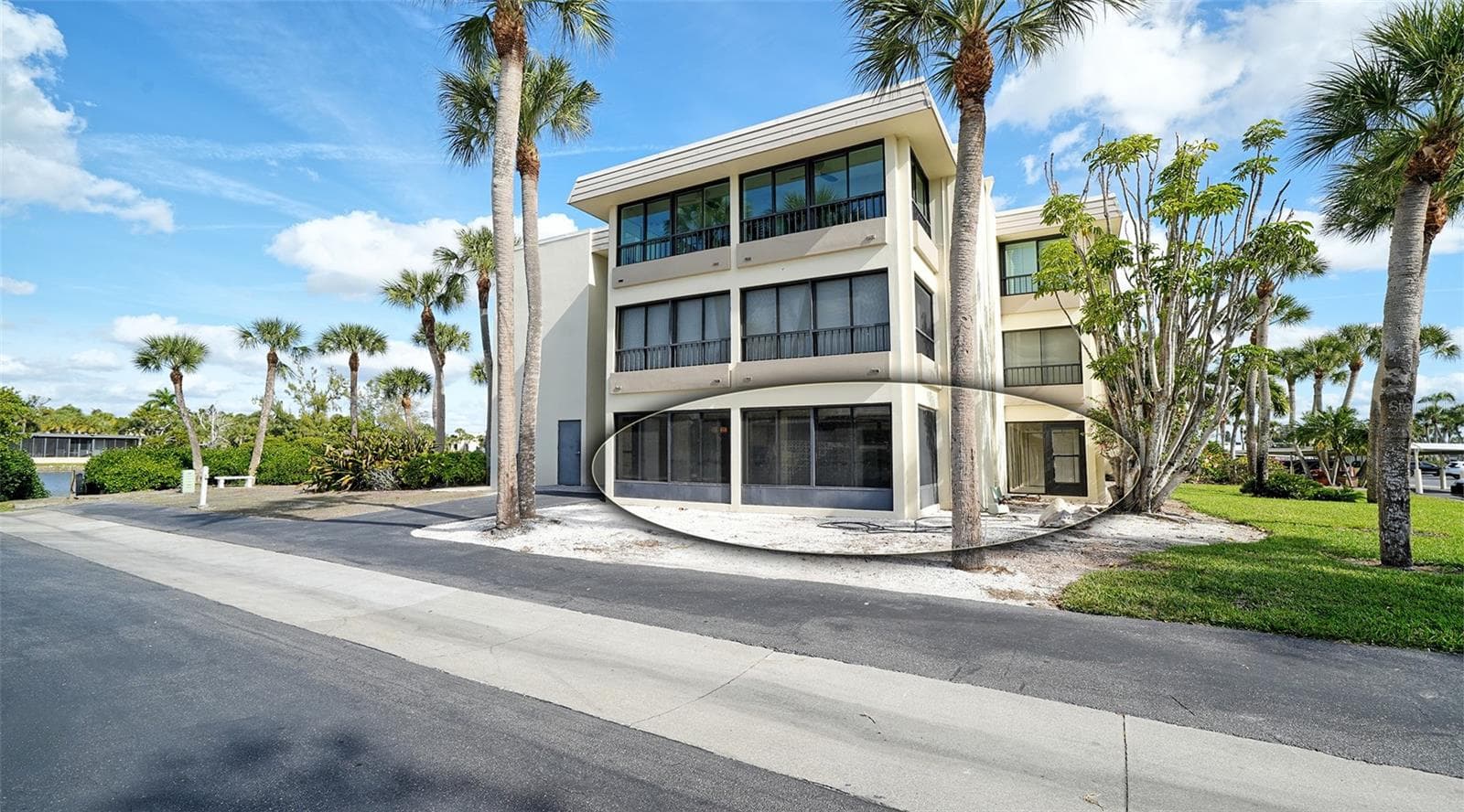 Looking back at the exterior of corner Unit #107. - 101 WHISPERING SANDS DR #107, SARASOTA