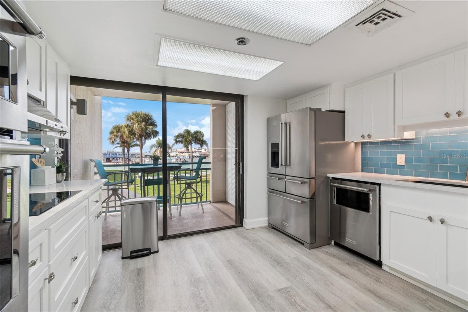 Updated kitchen. Quartz countertops, stainless steel appliances, plenty of cabinet space. - 1 KEY CAPRI #101E, TREASURE ISLAND