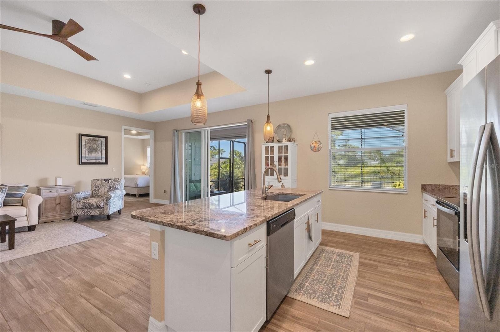 Beautifully neutral with beachy plank flooring - 112 BERYL DR, ROTONDA WEST
