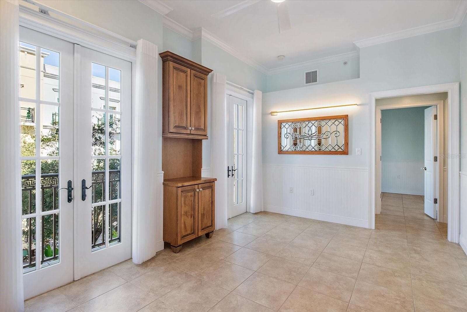 Living room featuring tile flooring and neutral finishes - 445 N ORANGE AVE #210, SARASOTA