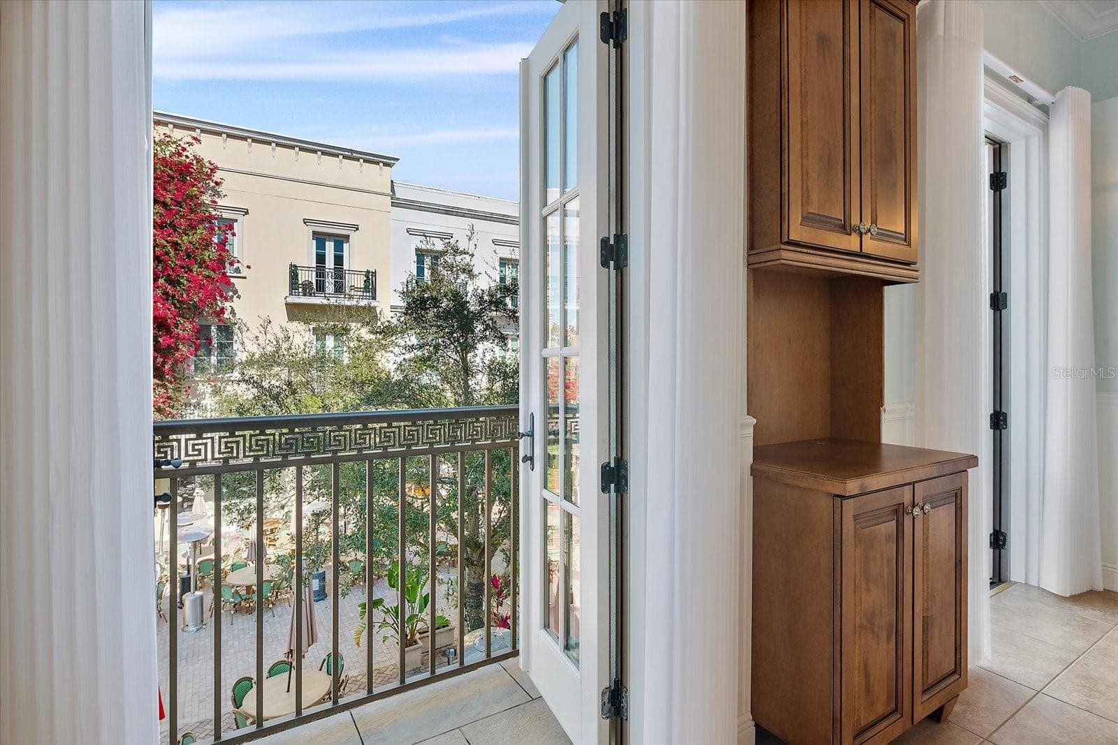 Courtyard-facing windows providing abundant natural light - 445 N ORANGE AVE #210, SARASOTA