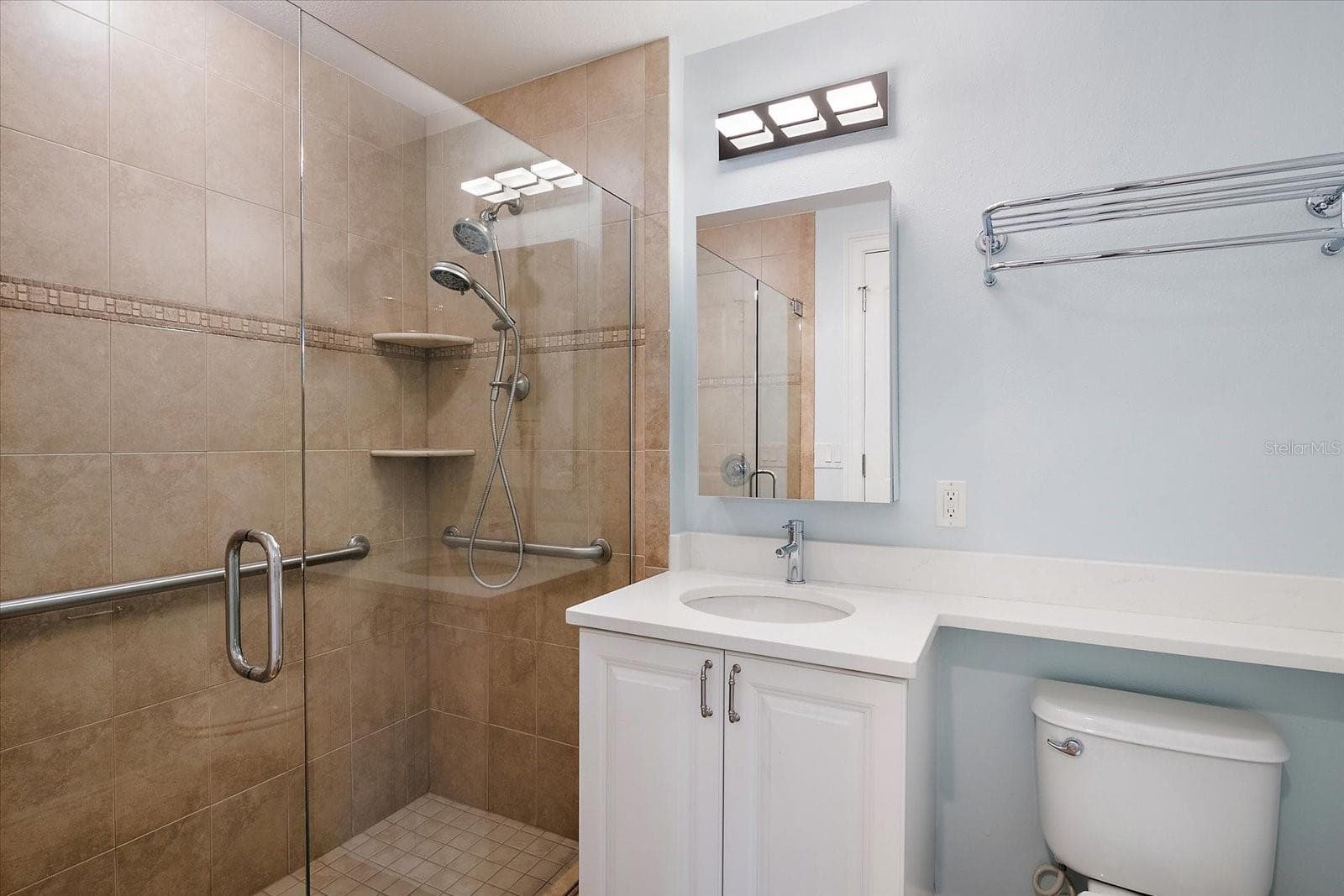 Bathroom with updated cabinetry and countertop - 445 N ORANGE AVE #210, SARASOTA