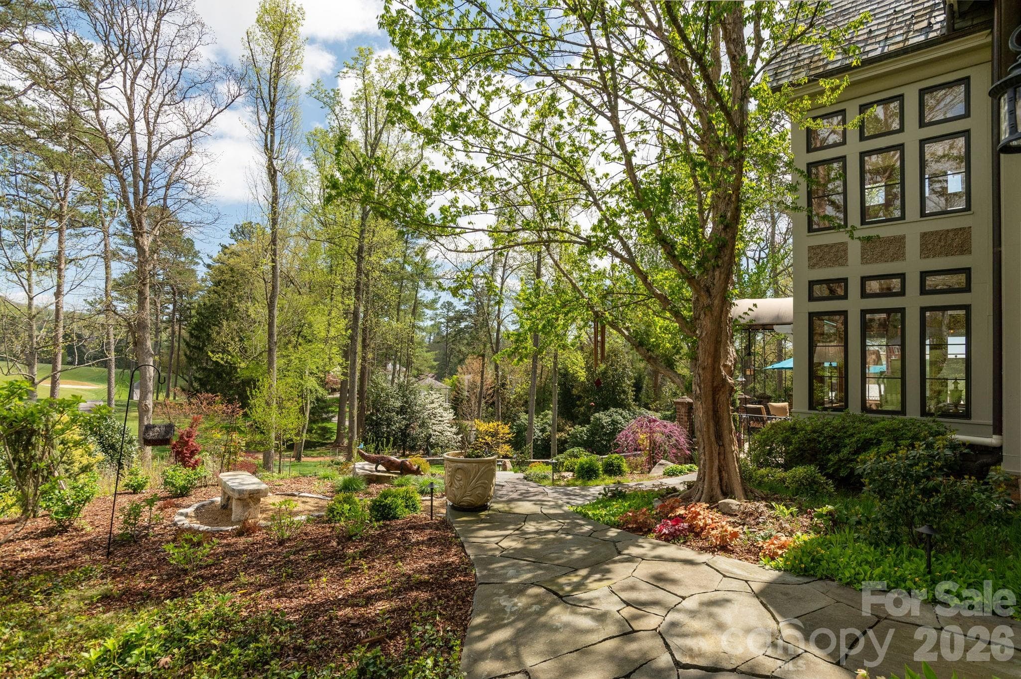 Stone walkways wind through landscaped gardens - 8 Fairway Place, Asheville