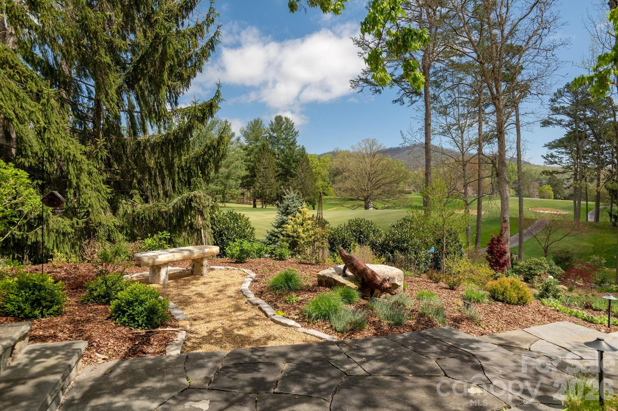 Multiple garden seating areas invite quiet relaxation - 8 Fairway Place, Asheville