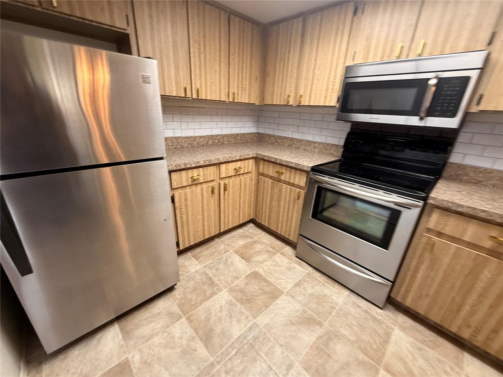 Newer stainless steal appliances - 12155 ENVIRONMENTAL DR #6, NEW PORT RICHEY