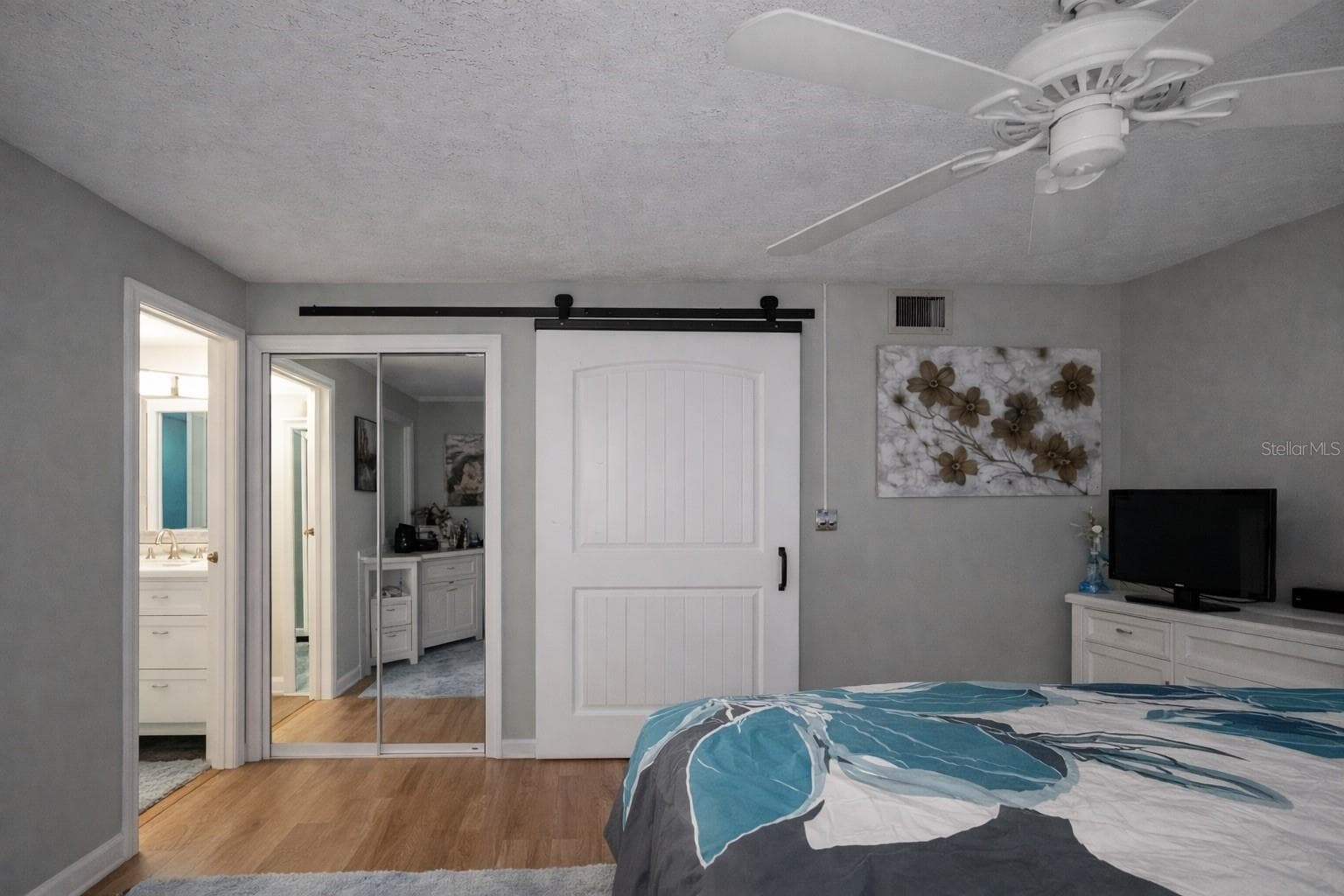 Master bedroom barn door - BELLEAIR PALMS TERRACE CONDO 2, BELLEAIR BLUFFS