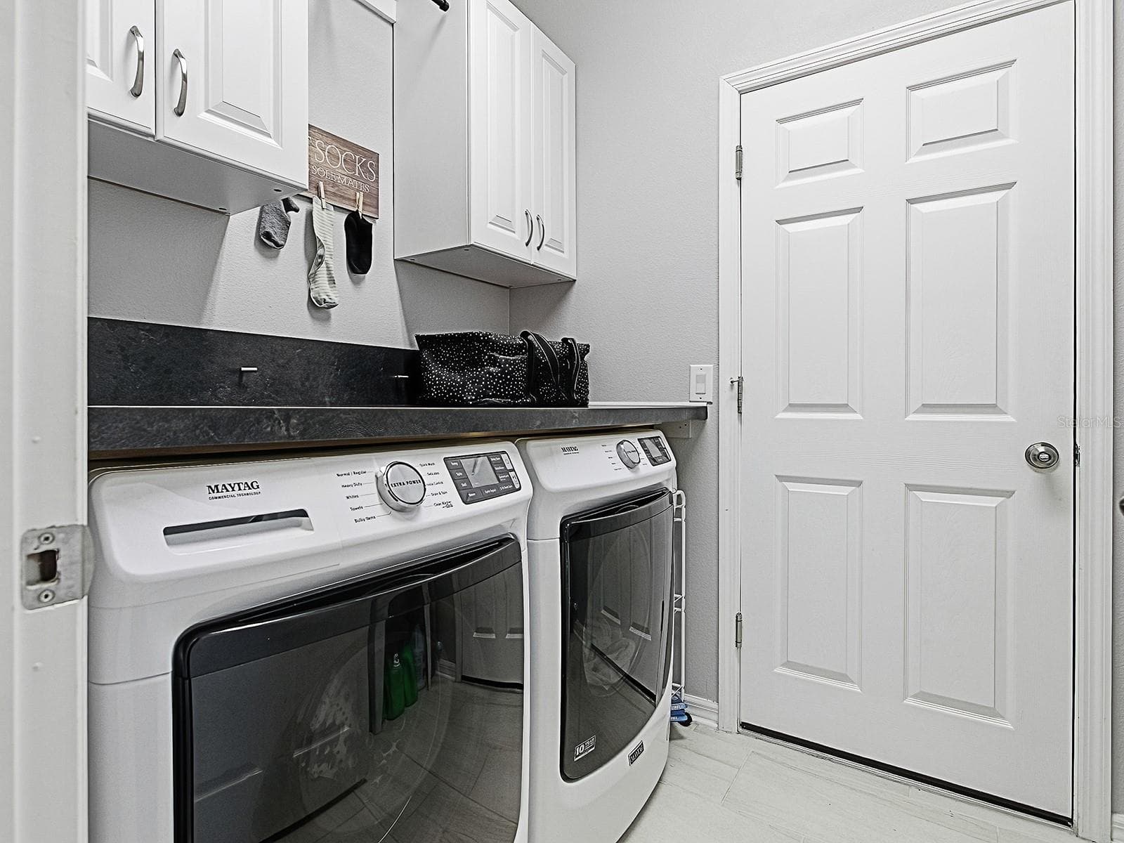 Convenient laundry room with ample space and storage - 417 BLUE CYPRESS DR, GROVELAND