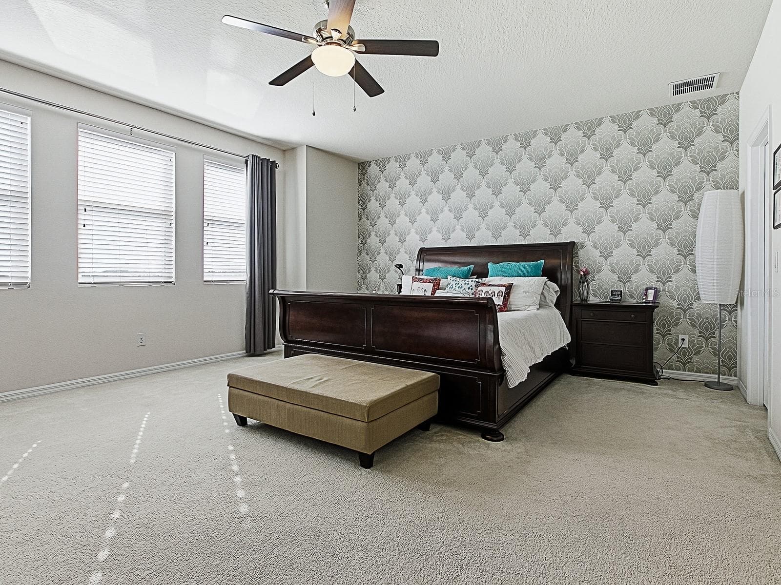 Expansive primary suite with stunning lake views. - 417 BLUE CYPRESS DR, GROVELAND
