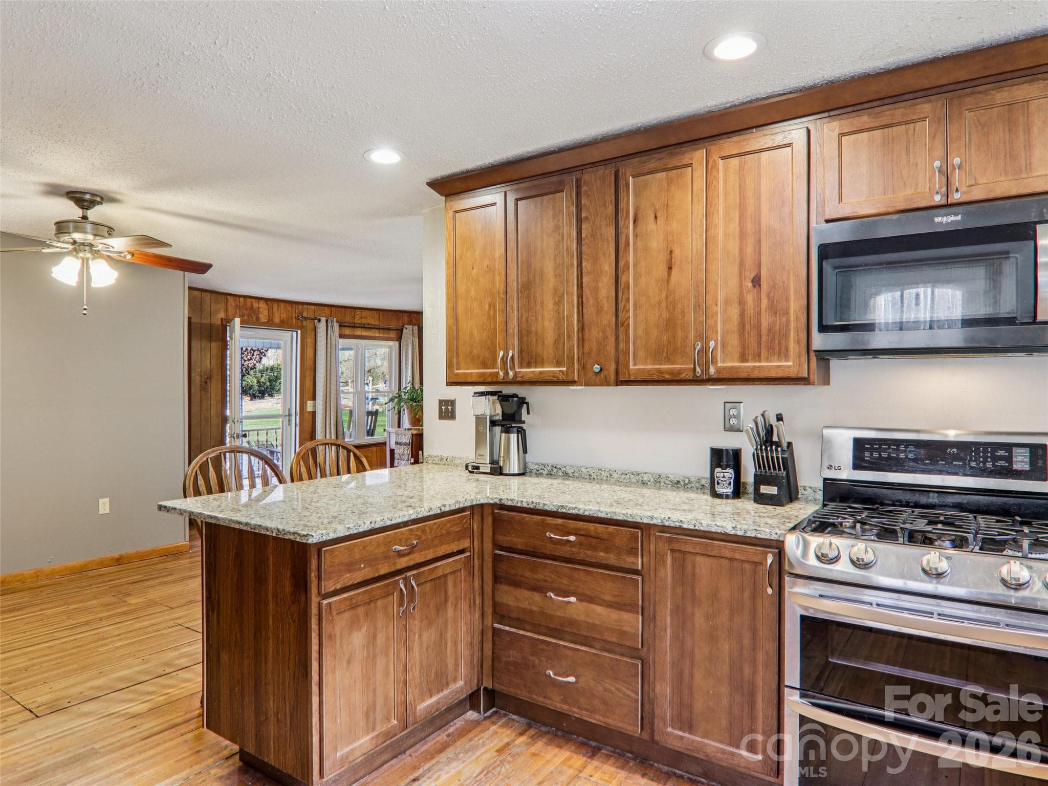 Alternate kitchen view into dining area and front entry - 7 Landon Mountain Lane, Weaverville