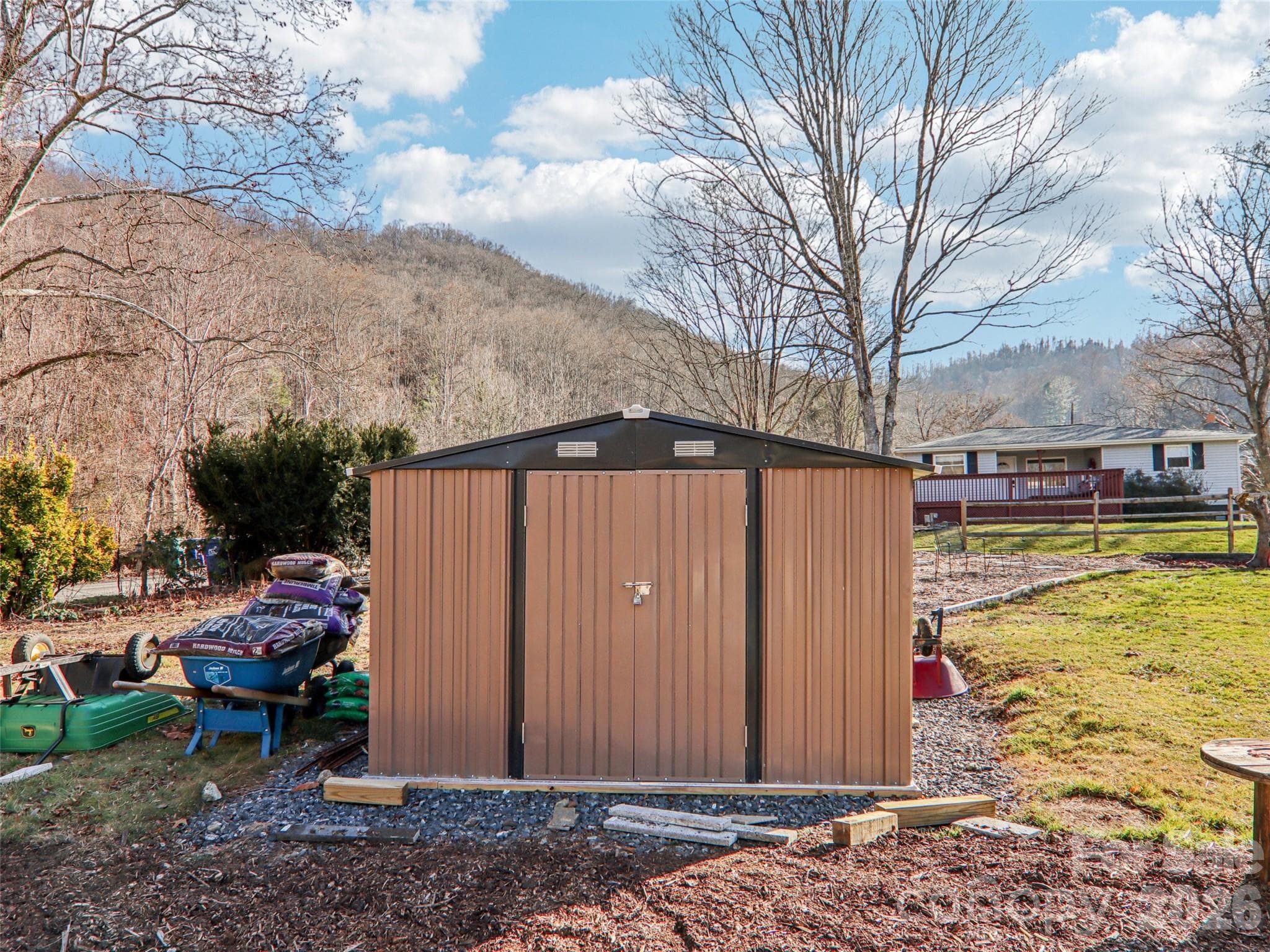 Detached storage shed with built-in shelves conveys - 7 Landon Mountain Lane, Weaverville