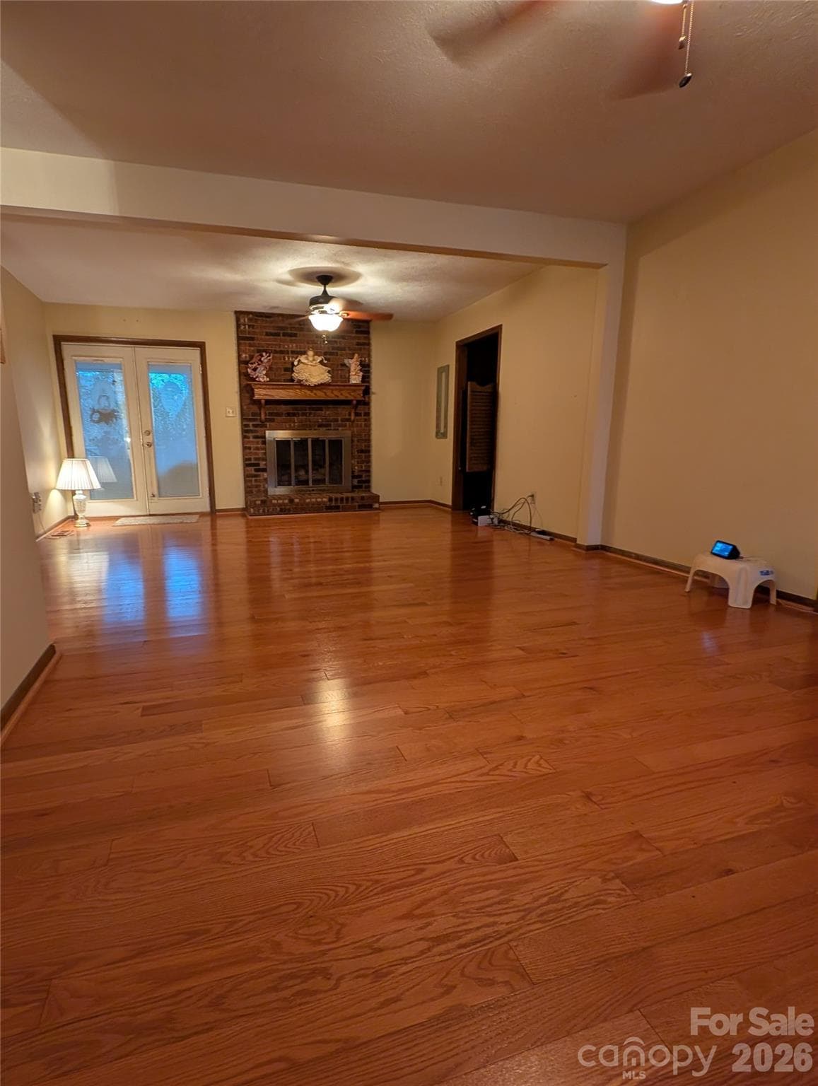 family room with pre finished wood floors and gas fireplace - 3065 Woodstream Drive, Valdese