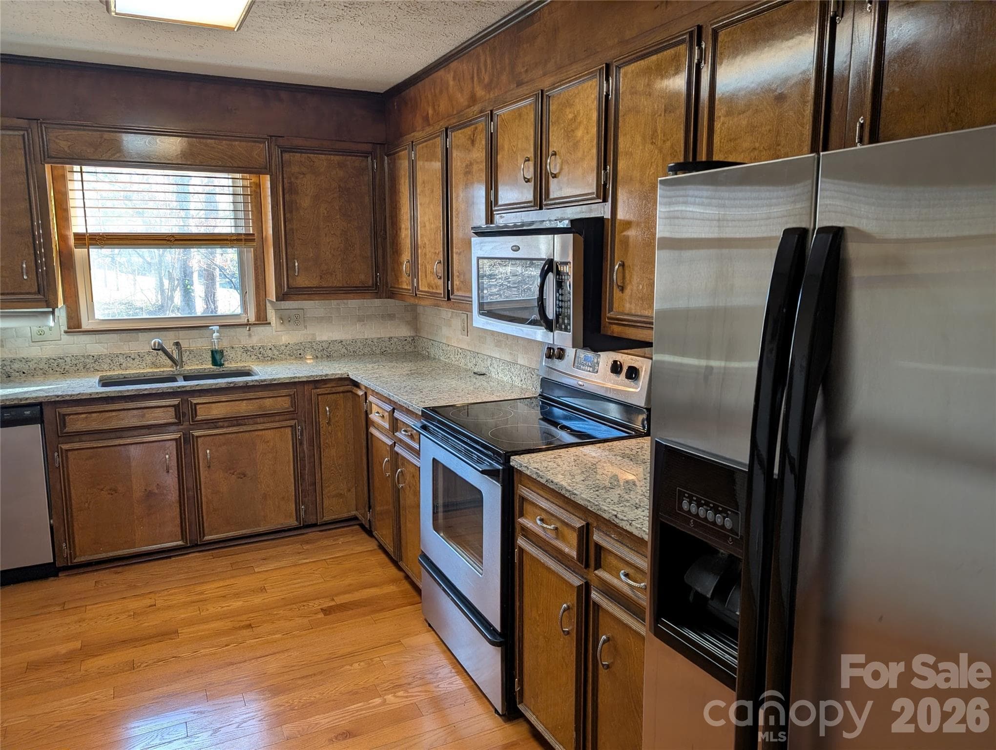 Kitchen with granite counter tops,deep granite sink,stainless appliances - 3065 Woodstream Drive, Valdese