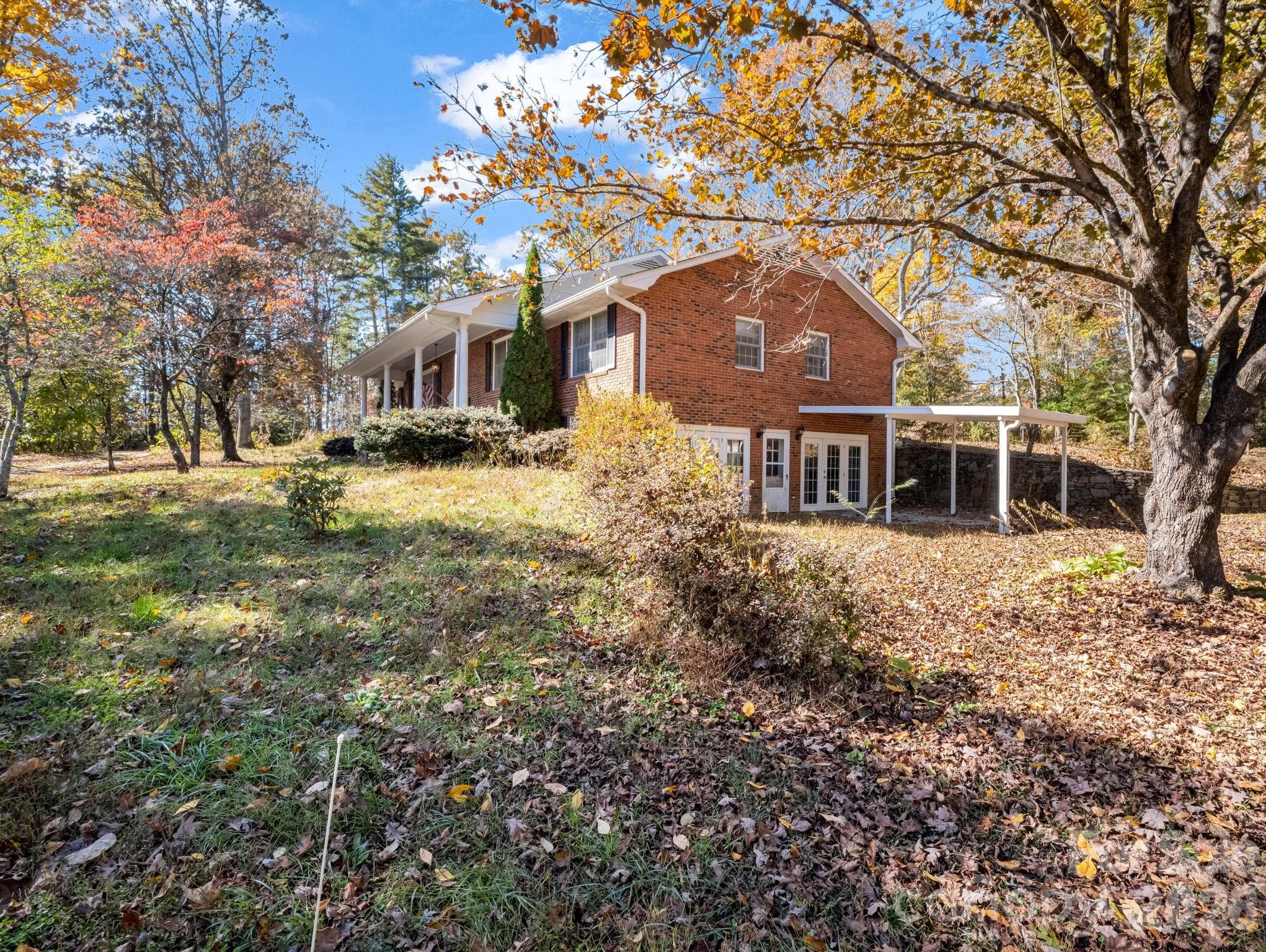 Carport area leads to full finished lower level. - Hendersonville