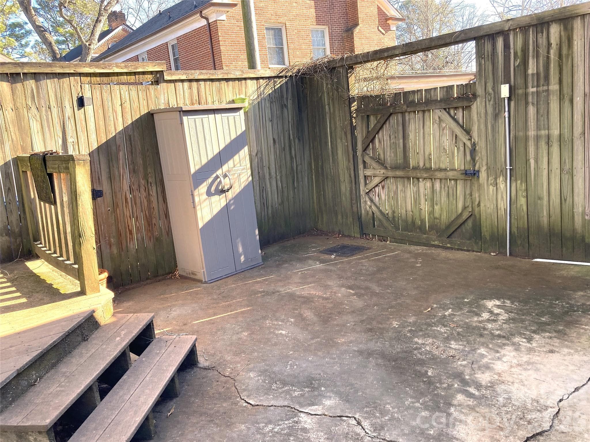Rear patio with small deck for grilling station. - 1051 Pee Dee Avenue, Albemarle