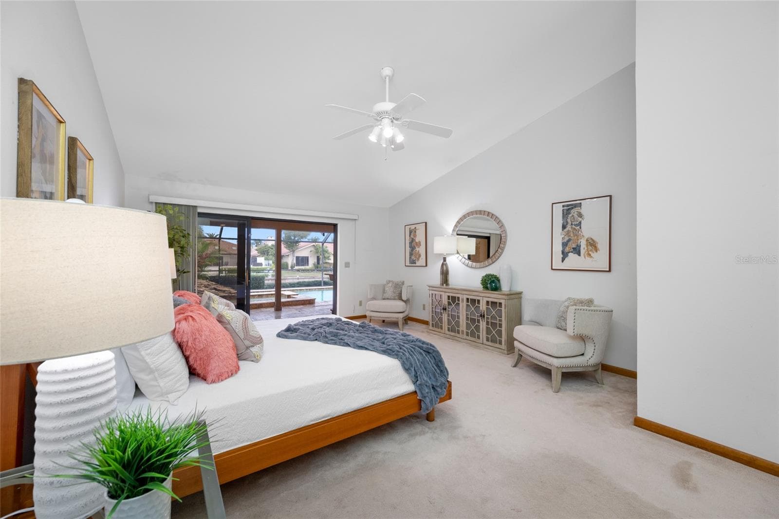 Primary Bedroom suite with triple sliders and private access to lanai and pool - 9807 COMPASS POINT WAY, TAMPA