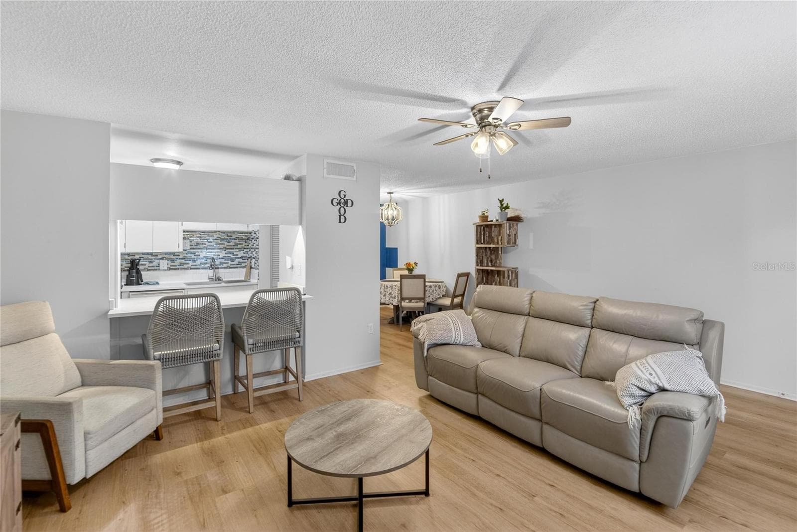 Living Room facing Kitchen & Dining Room - 11920 DIETZ DR #11920, TAMPA