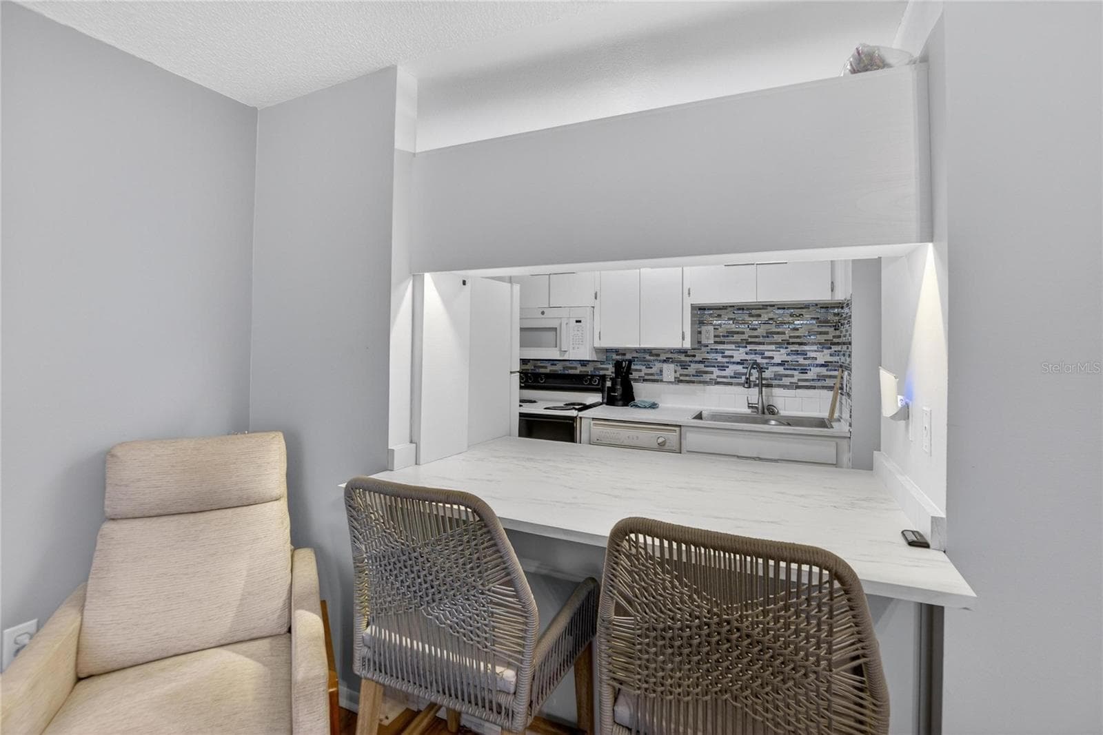 Kitchen Pass through Bar Seating Area - 11920 DIETZ DR #11920, TAMPA