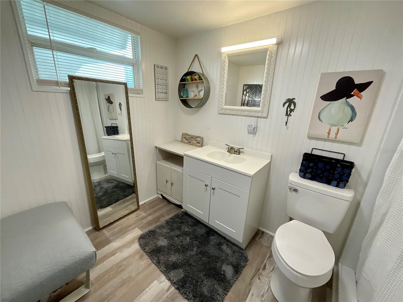 En-suite bathroom with new laminate, vanity, toilet and lighting - 6580 SEMINOLE BLVD #510, SEMINOLE