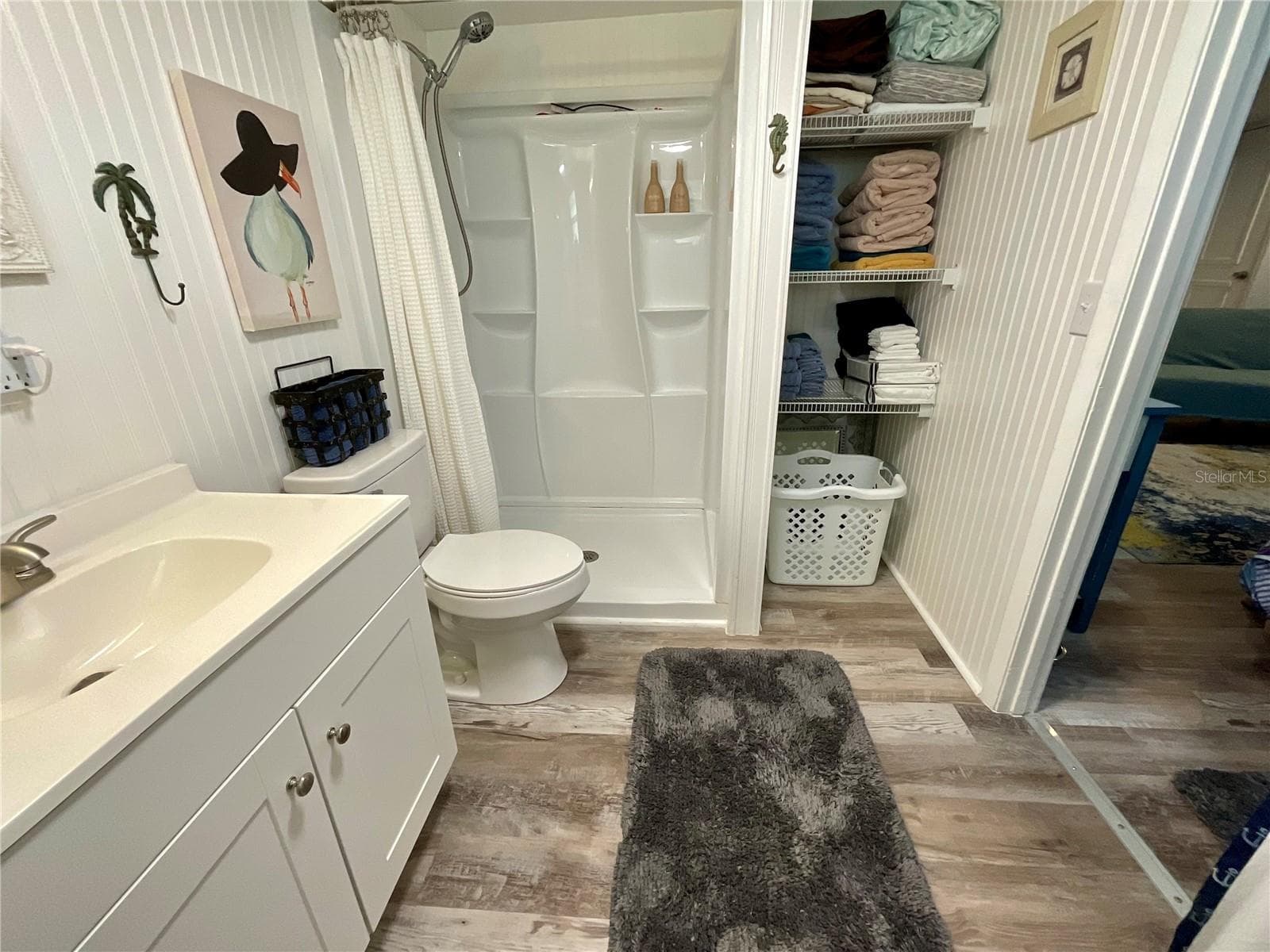 6.5’ x 9’ bathroom with linen closet and new stall shower insert - 6580 SEMINOLE BLVD #510, SEMINOLE
