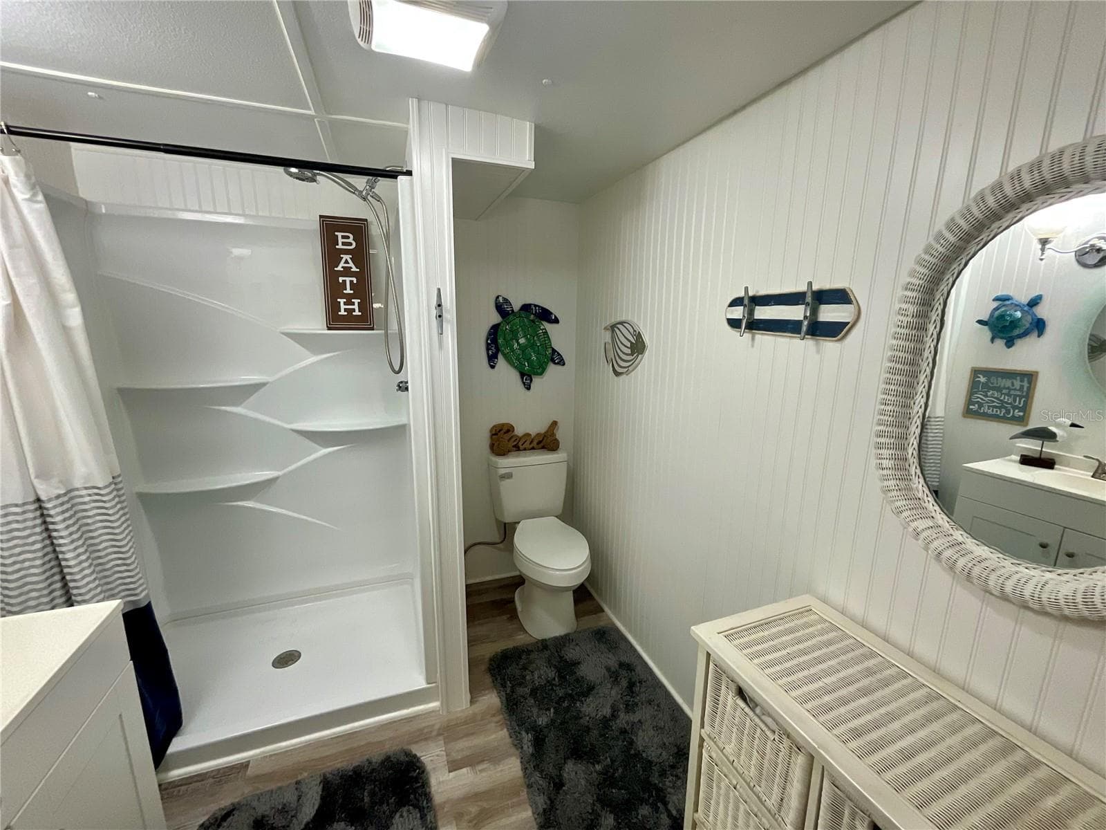 Hall bathroom:  New toilet, stall shower insert and lighting. Room is 7.5’ X 8’ - 6580 SEMINOLE BLVD #510, SEMINOLE
