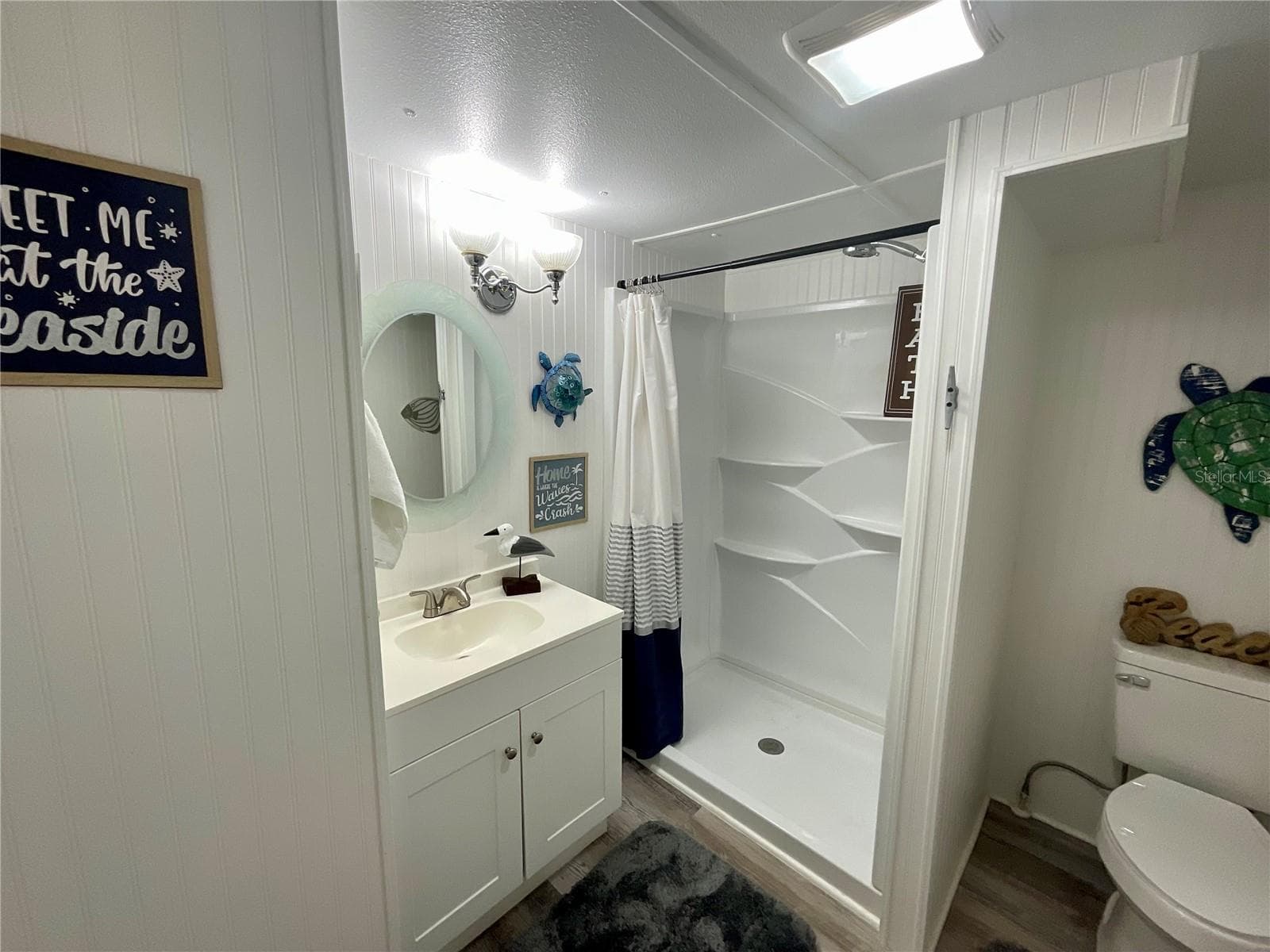 60 square foot bathroom also a new vanity, laminate flooring and faucets. Hand-held shower head is convenient for you plus it allows you to have an inside dog-wash station - 6580 SEMINOLE BLVD #510, SEMINOLE