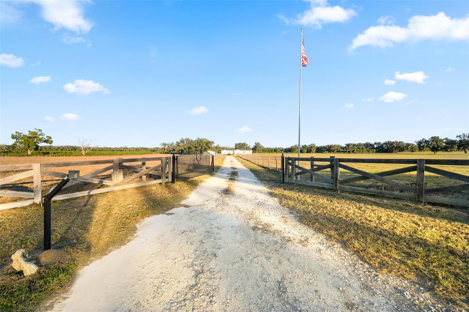 Beautiful wrought iron entry gate to property - 3789 NW 202ND ST, NEWBERRY