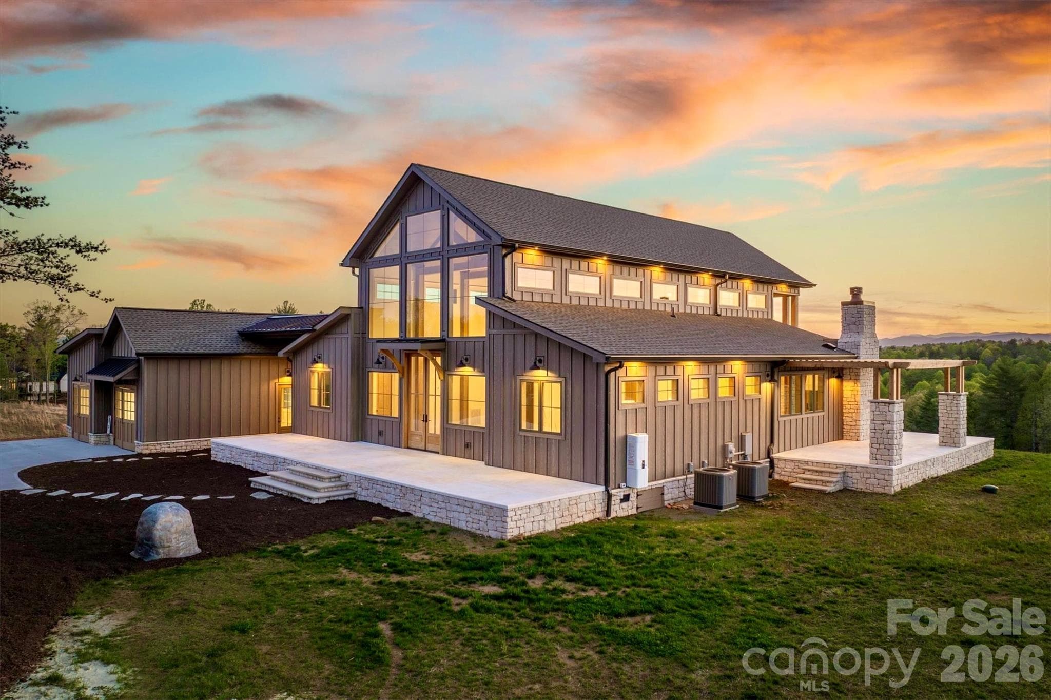 2 story windows and 10' French doors flood the open floor plan with natural light - Lenoir