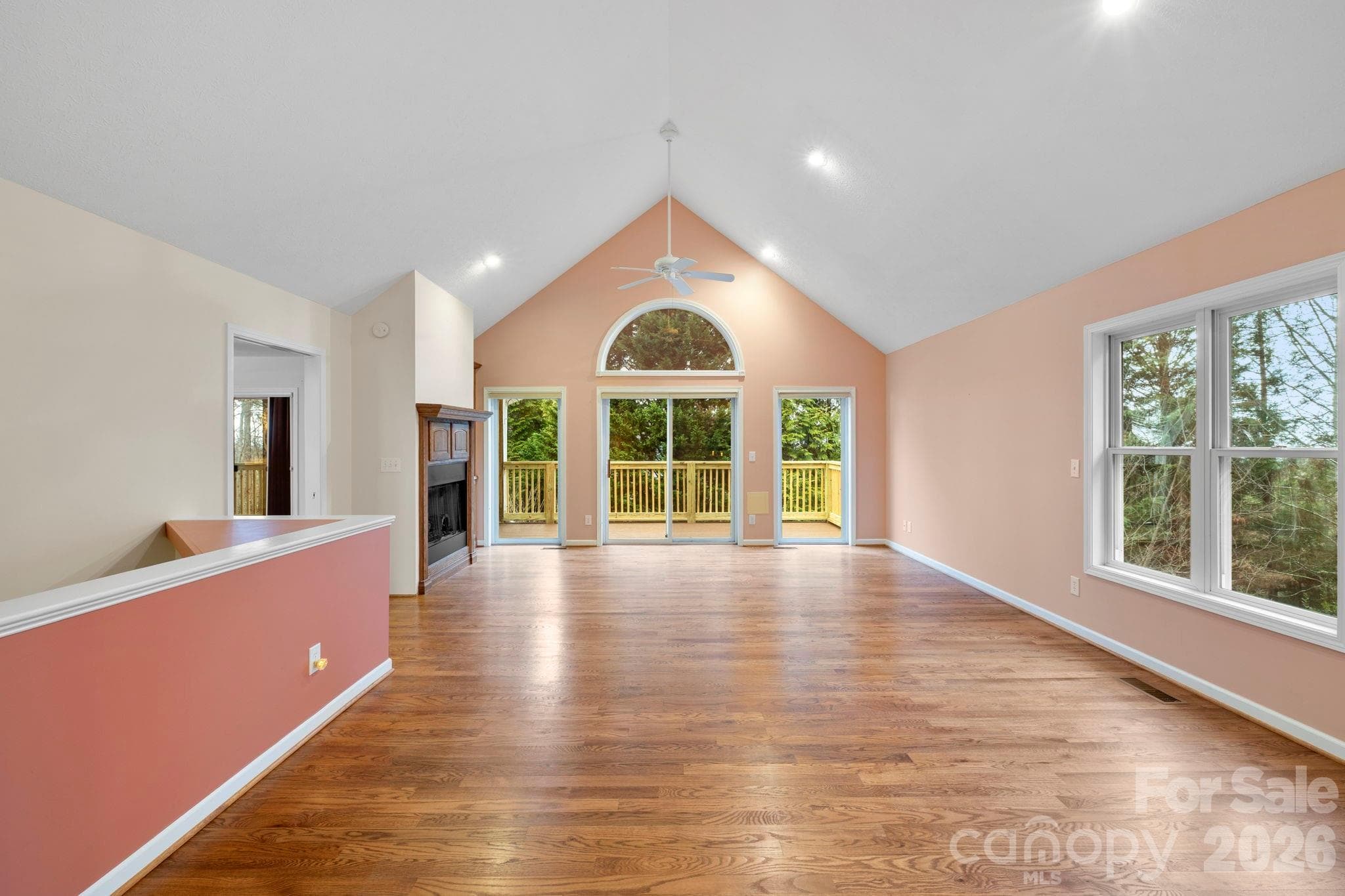 Open great room with loads of natural light and gorgeous hardwood floors - 242 Carriage Summitt Way, Hendersonville