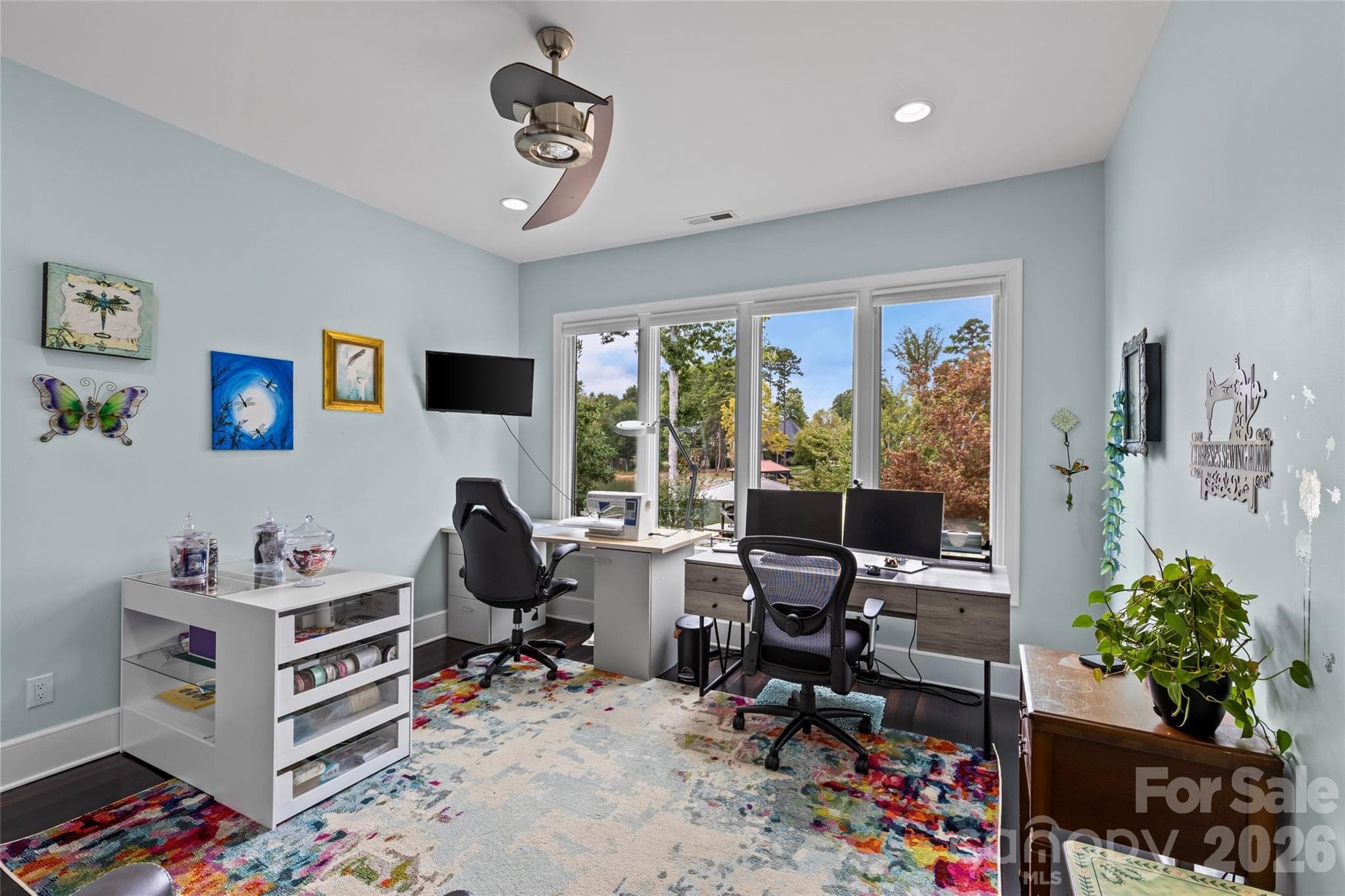 Lower level features an oversized family room with gas fireplace, 3 bedrooms, 2 full bathrooms, incredible walk in storage & sliding door access to the screened in porch. - 6032 Headlands Court, Belmont