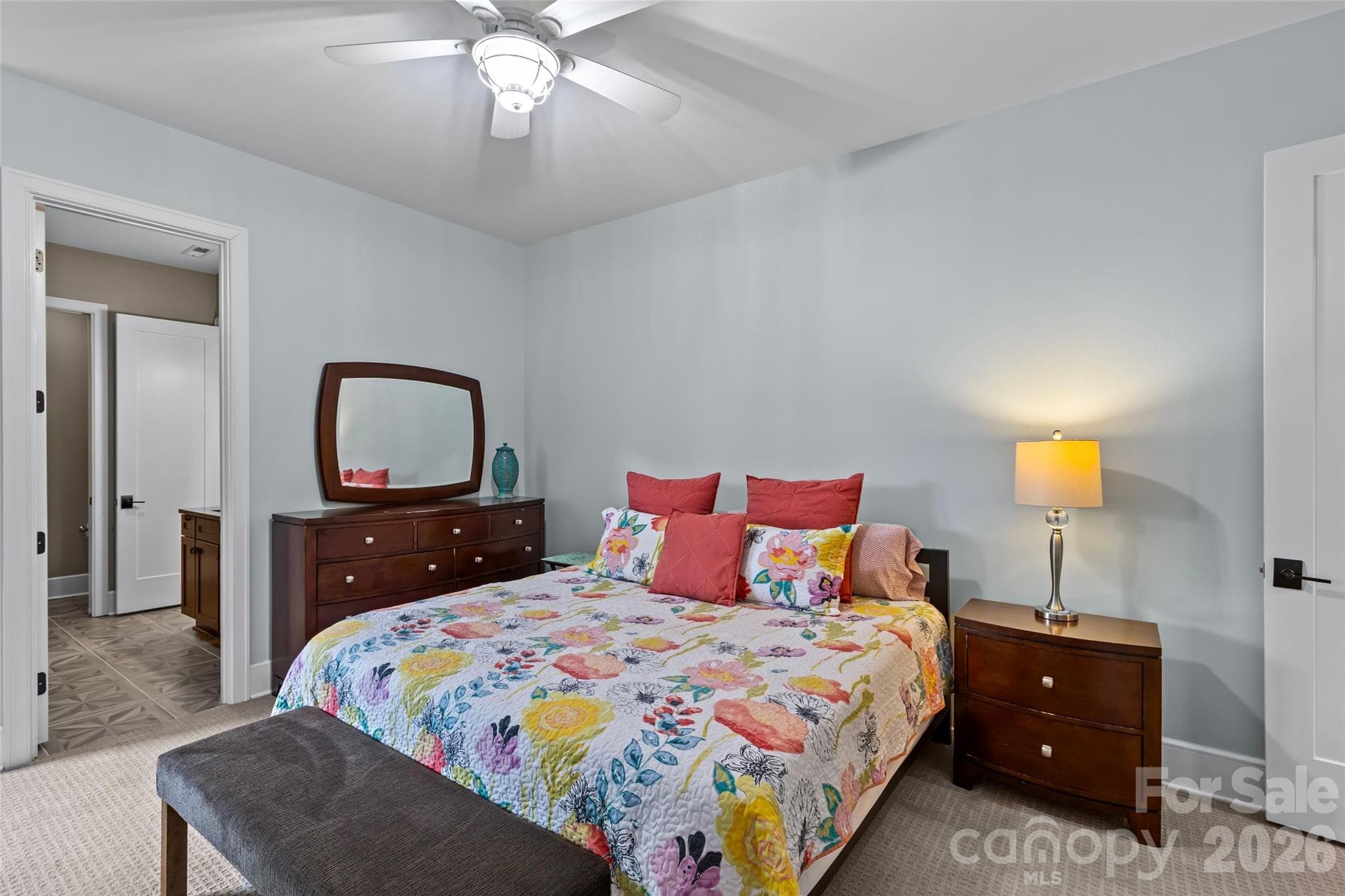 Lower level features an oversized family room with gas fireplace, 3 bedrooms, 2 full bathrooms, incredible walk in storage & sliding door access to the screened in porch. - 6032 Headlands Court, Belmont