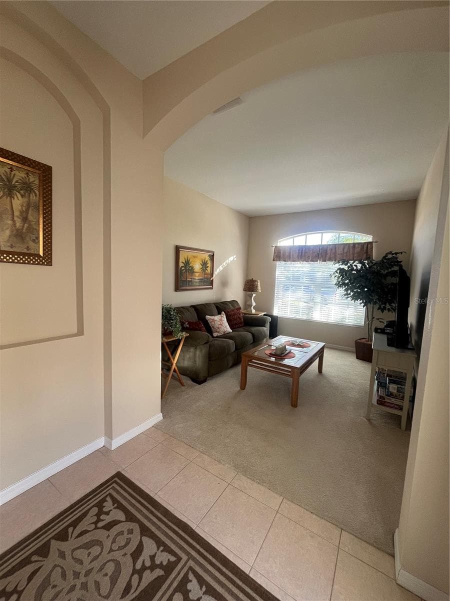 First Living room. It could be used as an office, extra room! - 23835 CORAL RIDGE LN, LAND O LAKES