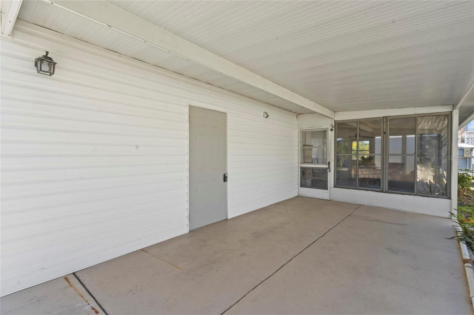 Carport with door to laundry - 426 HATCHETT CREEK RD, VENICE