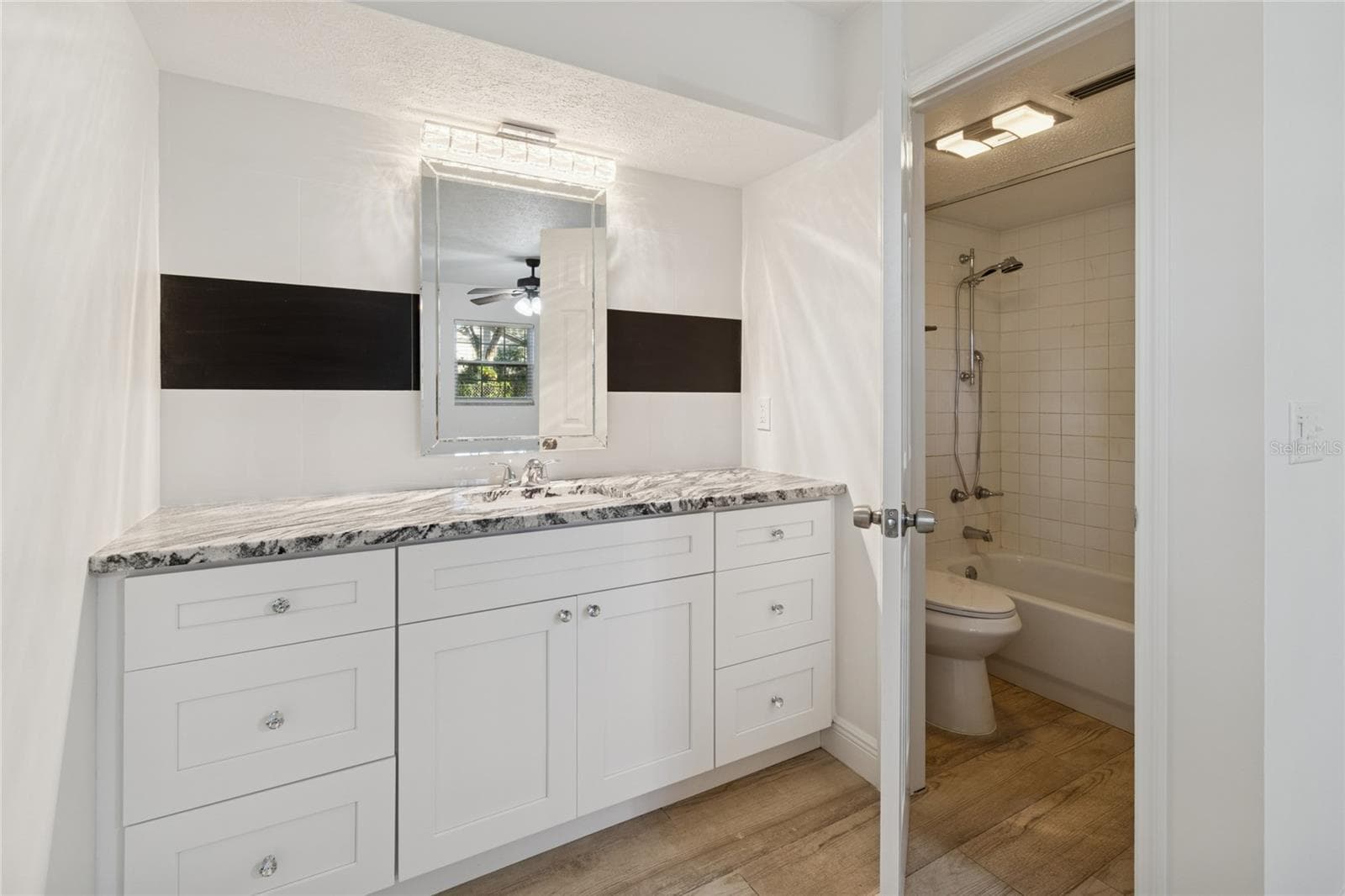 Sink with Stone Counter Top - 9628 DAVIS RD, TAMPA