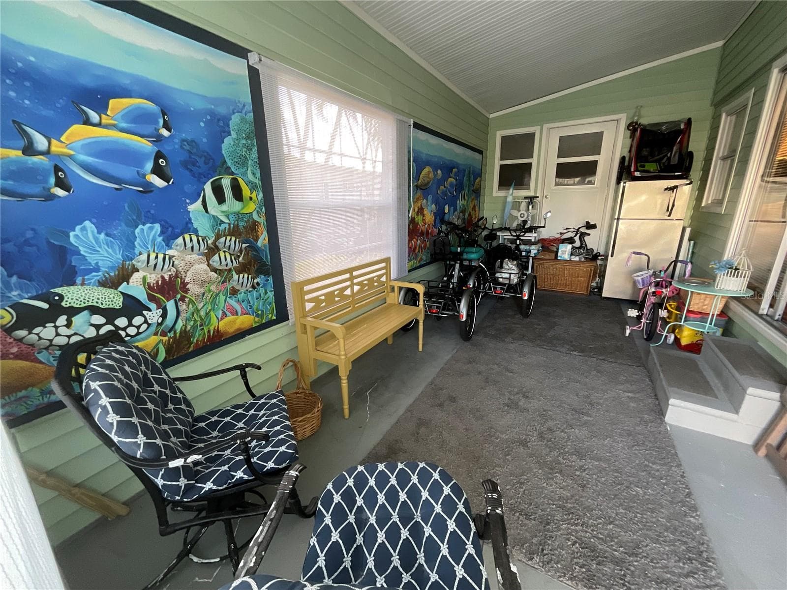 12’x18’ Bonus room. An additional refrigerator is stored here. This room is naturally lit and is at ground level. Door at the end of the room enters Master Bedroom. - 6580 SEMINOLE BLVD #510, SEMINOLE