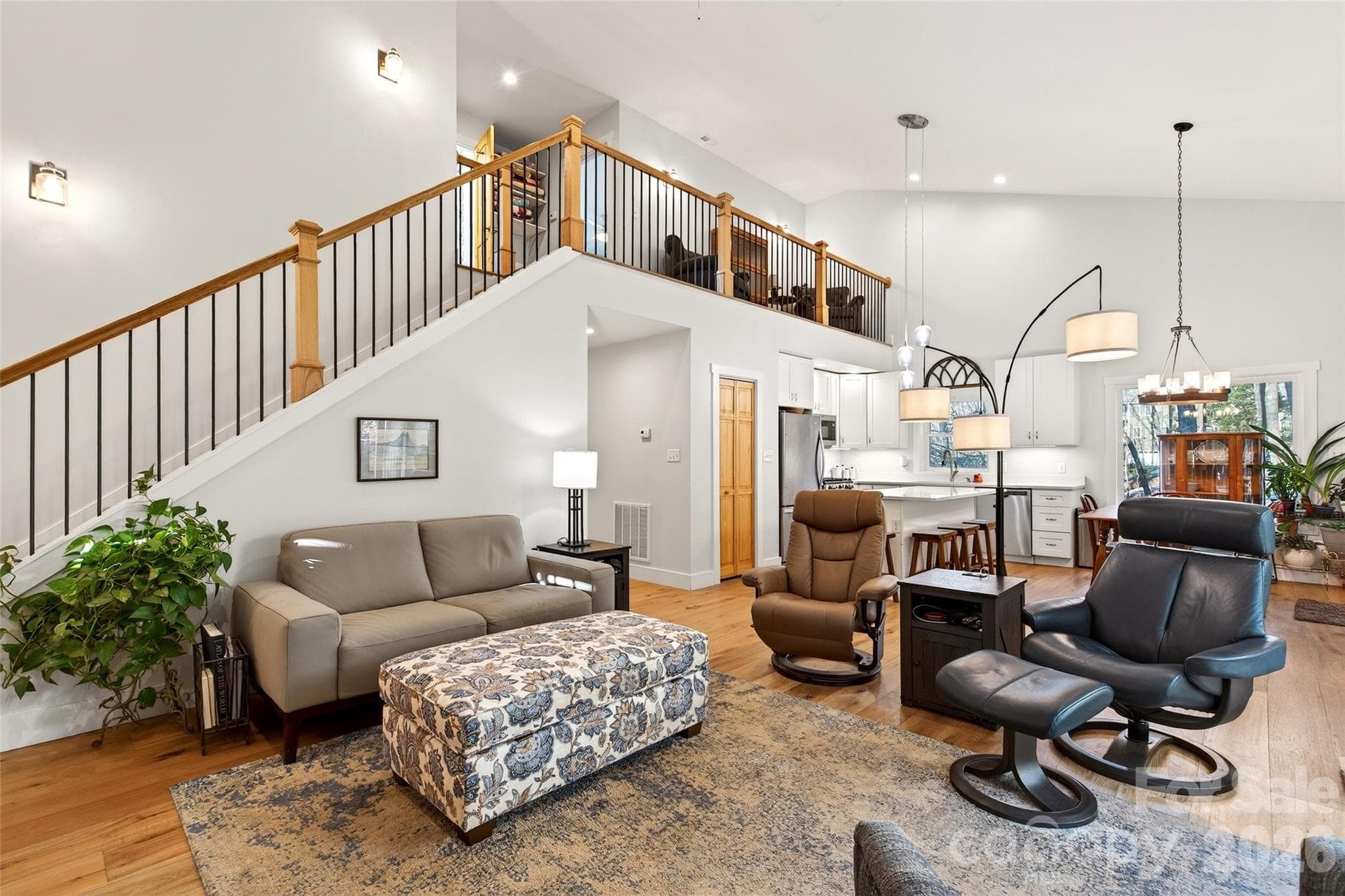 Main floor living with primary bedroom, laundry and kitchen. - 1413 Golf Course Road, Old Fort