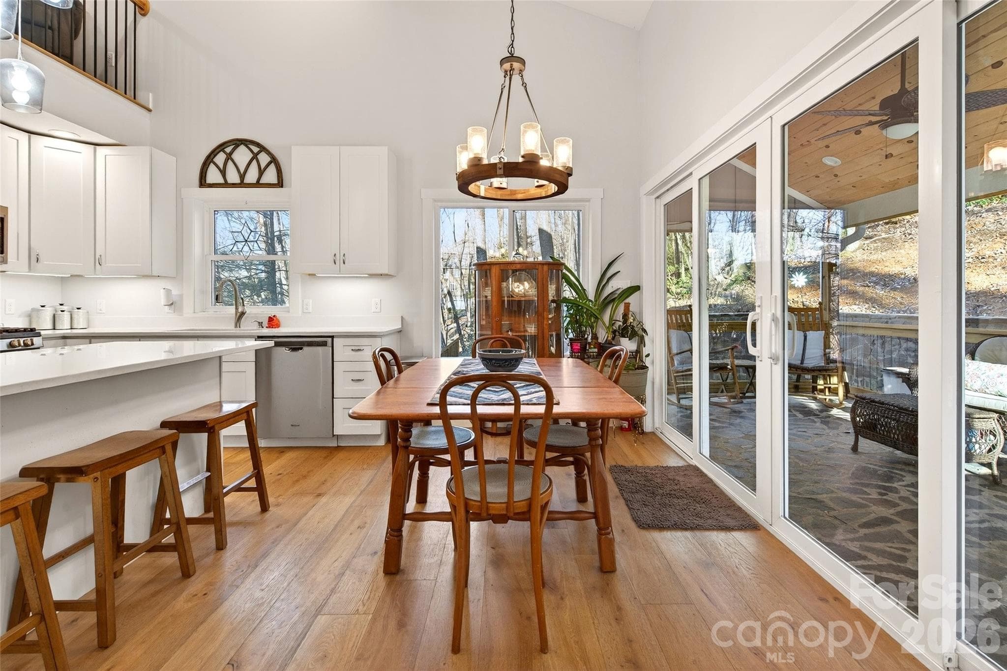 Plenty of seating for friends and family. Kitchen and dining flow into the screened in porch. - 1413 Golf Course Road, Old Fort