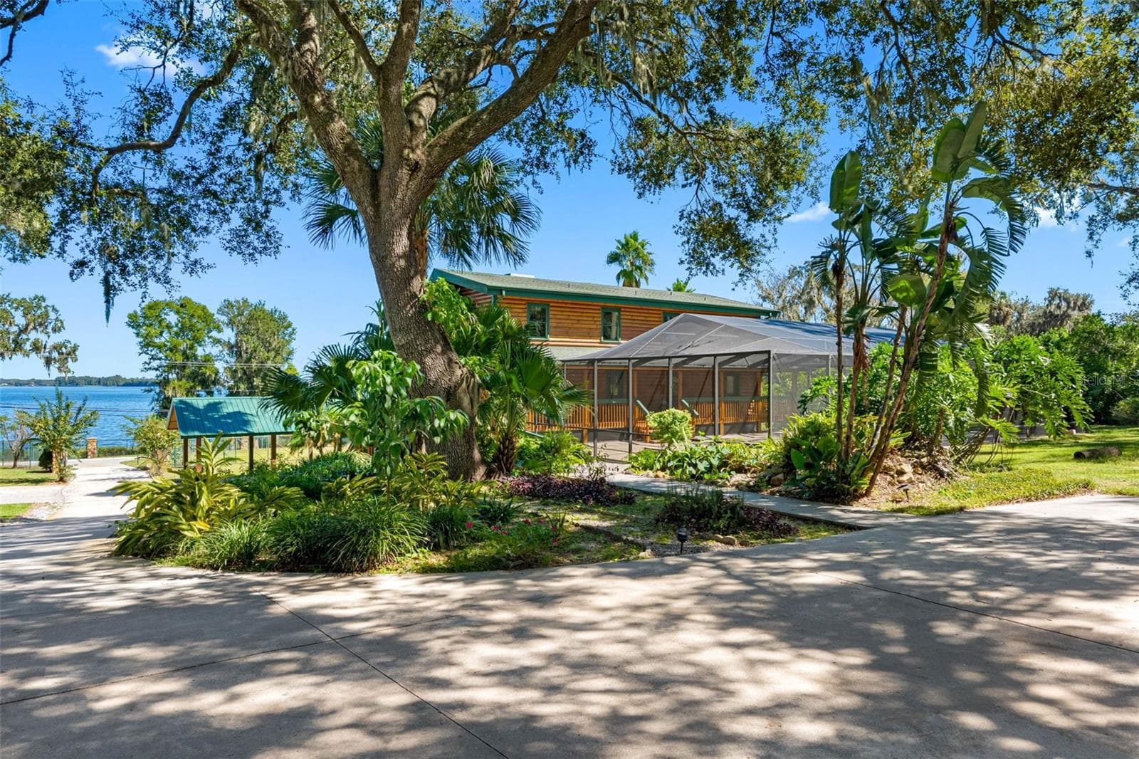 Side of Home with Koi Pond - 11401 THONOTOSASSA RD, THONOTOSASSA