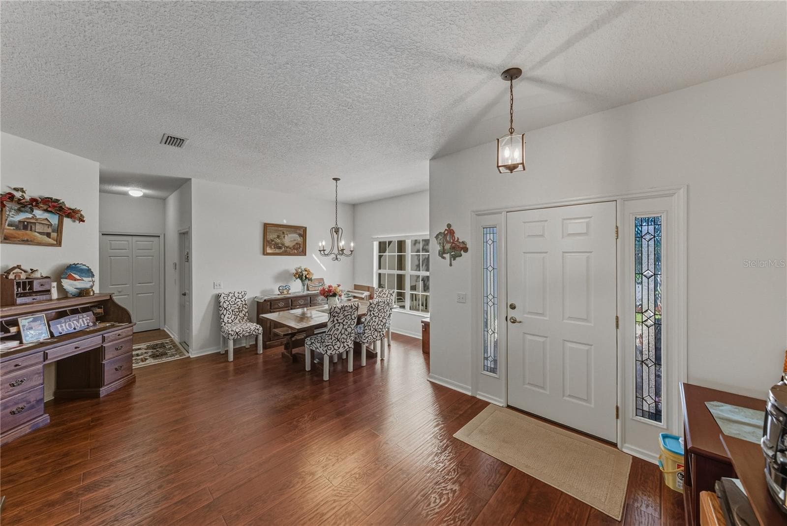 The dining room area shares the front of the home with the foyer. - 4360 ASHTON CLUB DR, LAKE WALES