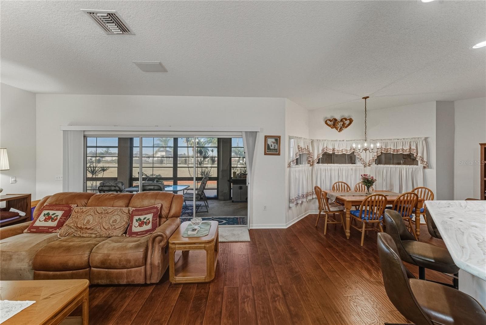 The dinette is in the alcove off the kitchen and living room. - 4360 ASHTON CLUB DR, LAKE WALES