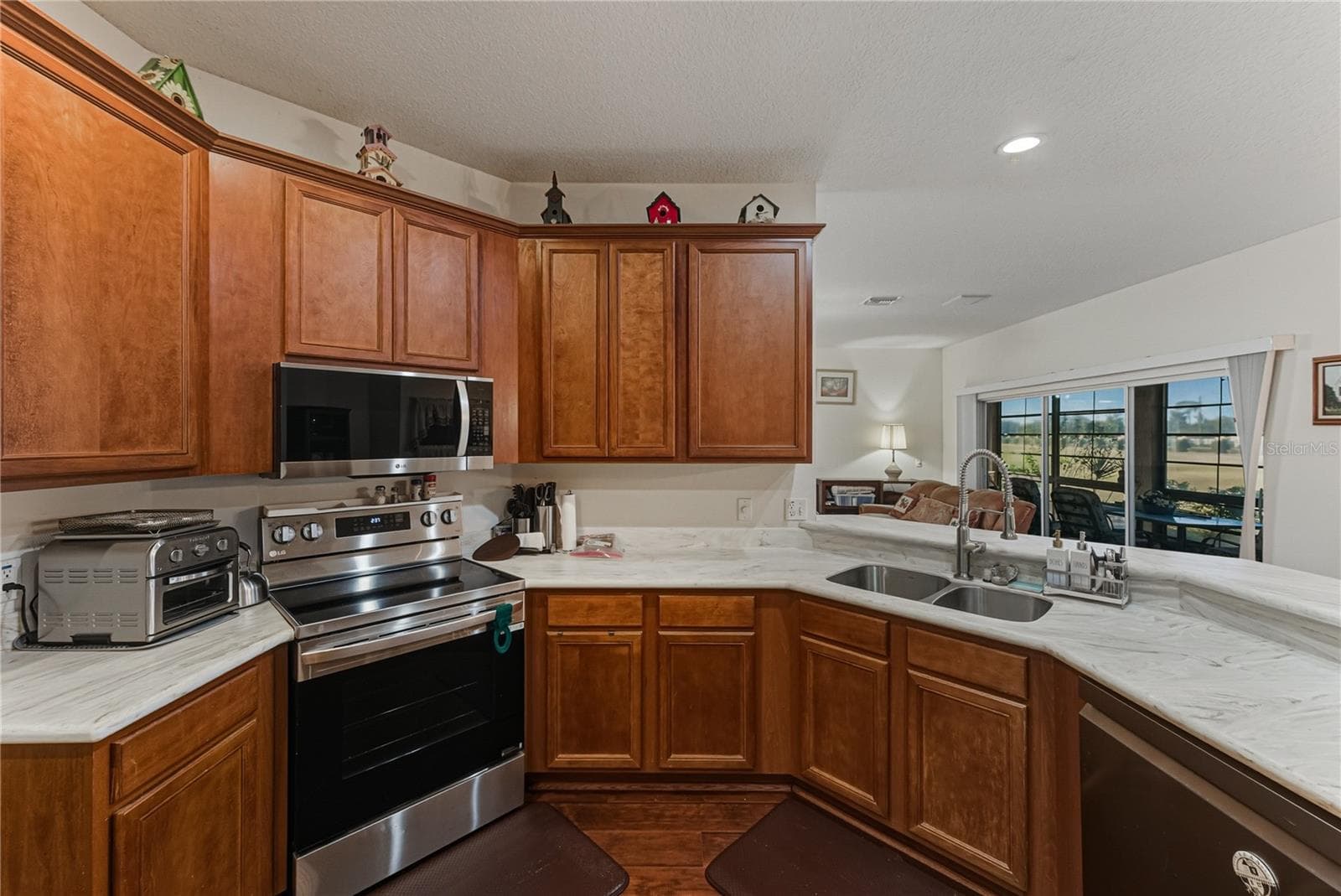 The ample cabinetry and Corian countertops make this a chef's dream. - 4360 ASHTON CLUB DR, LAKE WALES