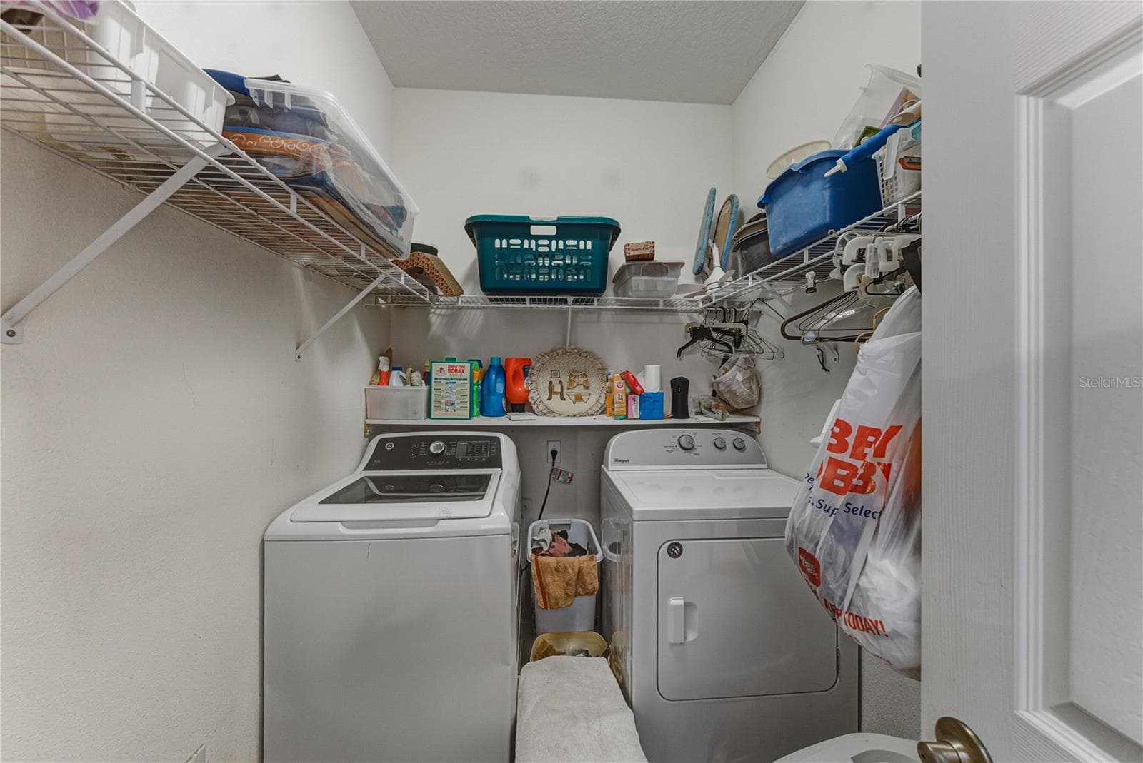 The laundry room is in the primary suite. The washer and dryer stay for the new owners. - 4360 ASHTON CLUB DR, LAKE WALES