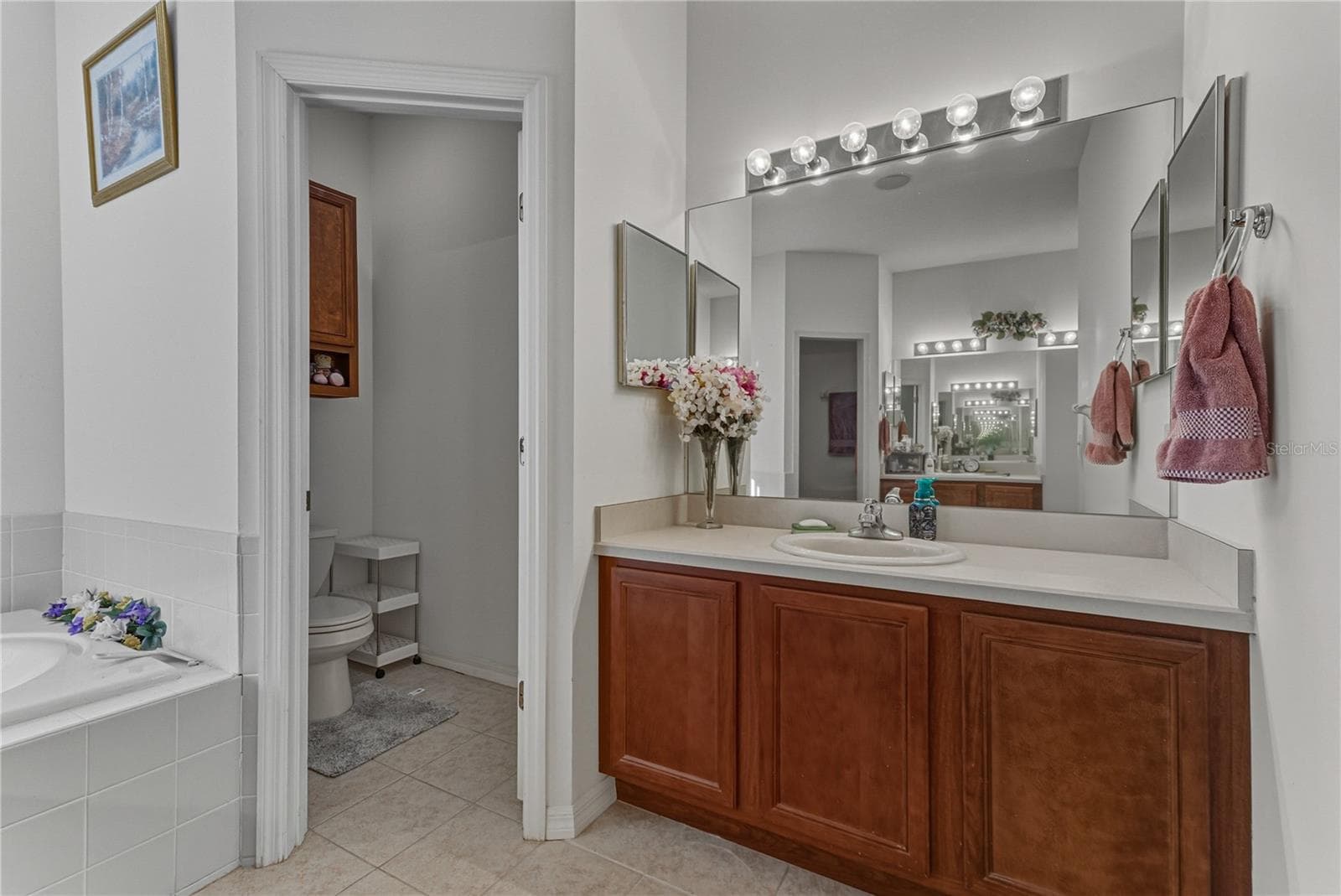 The second vanity is on the opposite wall from the other vanity. - 4360 ASHTON CLUB DR, LAKE WALES