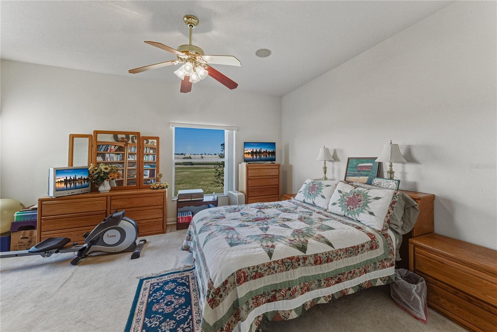 The second bedroom is at the rear of the home and has a ceiling fan with light. - 4360 ASHTON CLUB DR, LAKE WALES