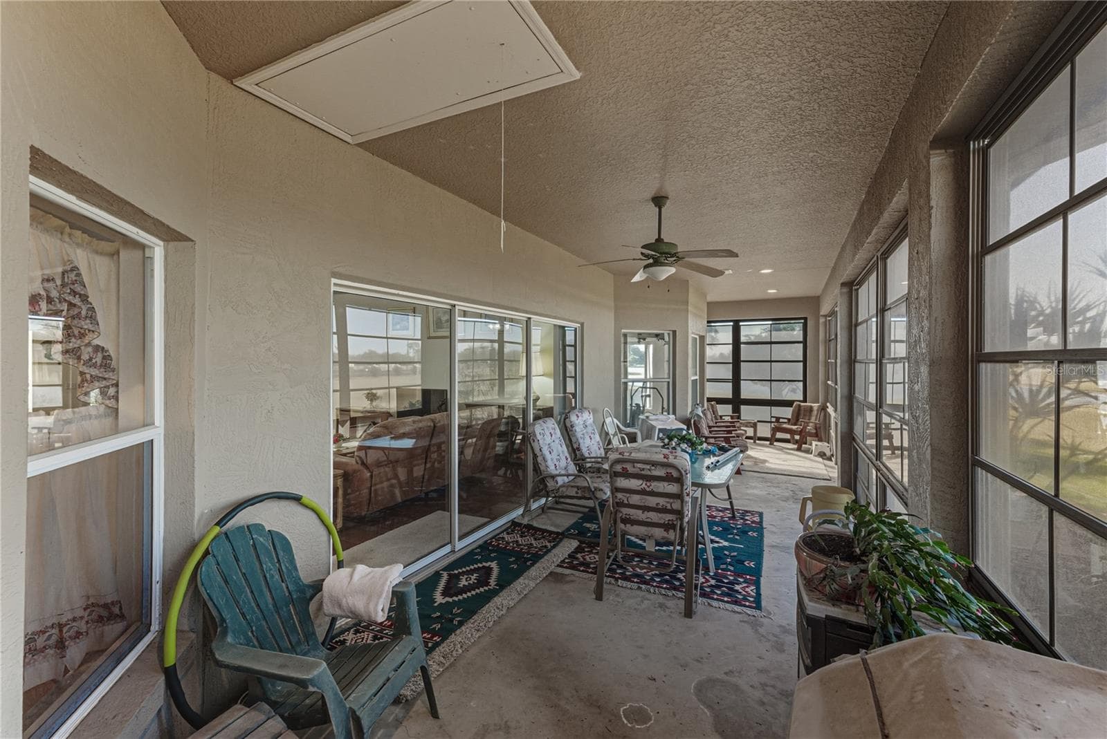 The attic is accessible through the pull-down ladder in the lanai. - 4360 ASHTON CLUB DR, LAKE WALES