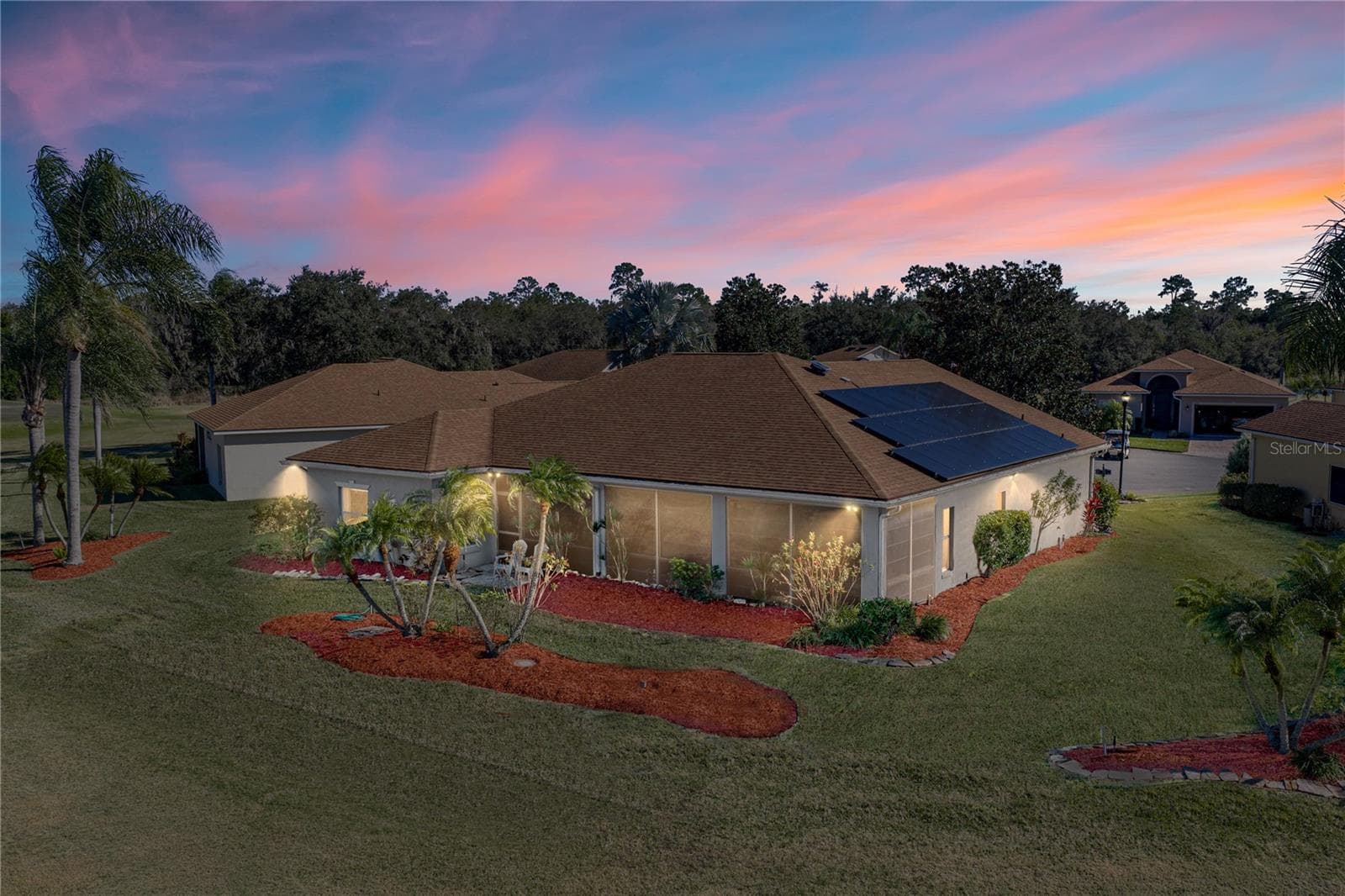 The large lanai dominates the rear of this home. The quality landscaping surrounds this home. - 4360 ASHTON CLUB DR, LAKE WALES