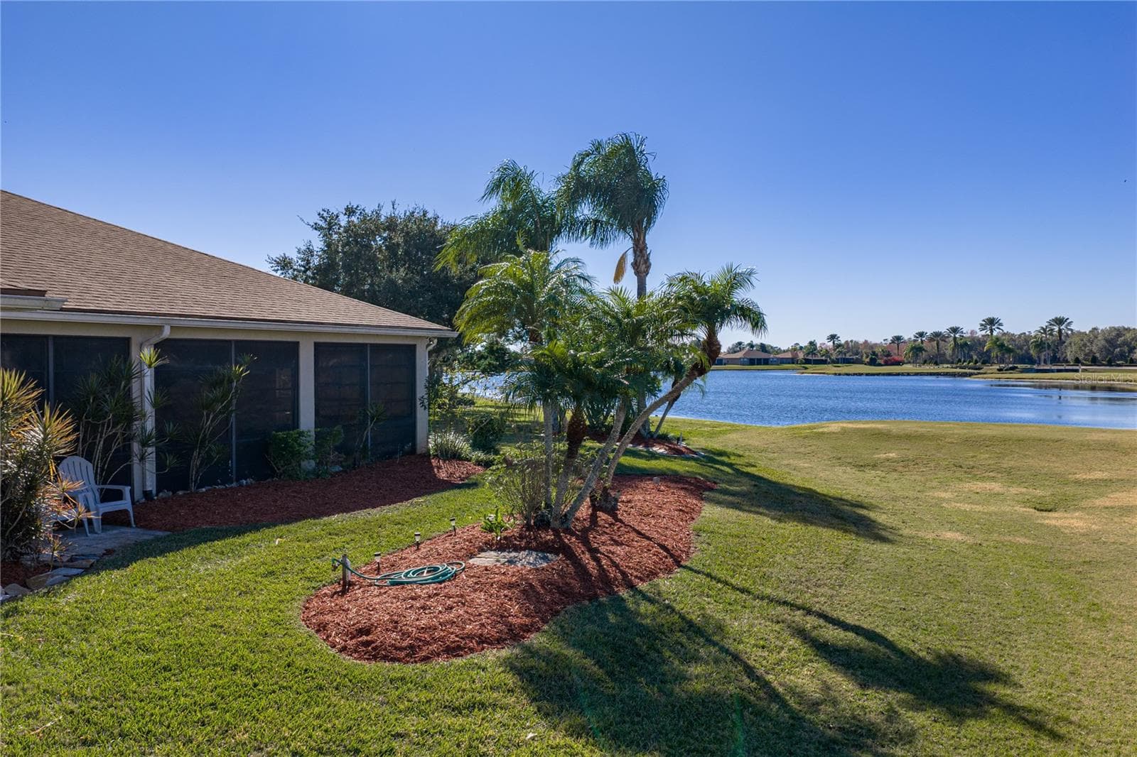 The home looks out to the entire 11th hole with its signature island green. - 4360 ASHTON CLUB DR, LAKE WALES