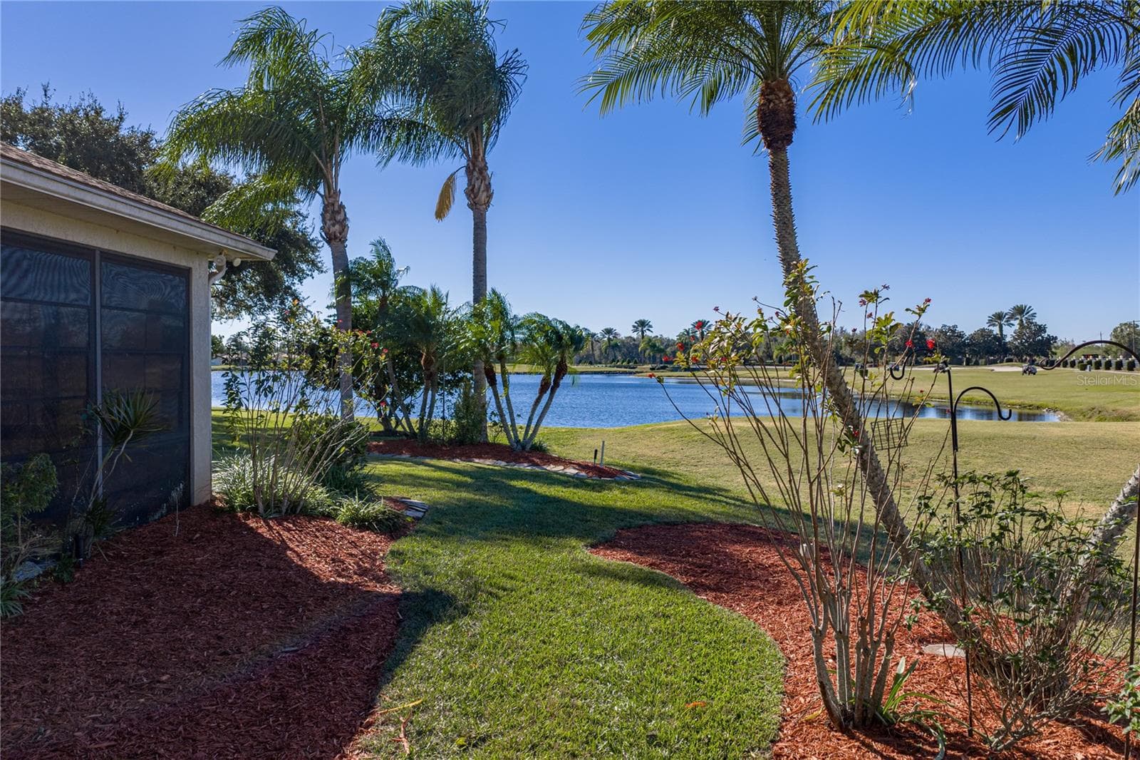 A large pond is at the rear of the property. - 4360 ASHTON CLUB DR, LAKE WALES