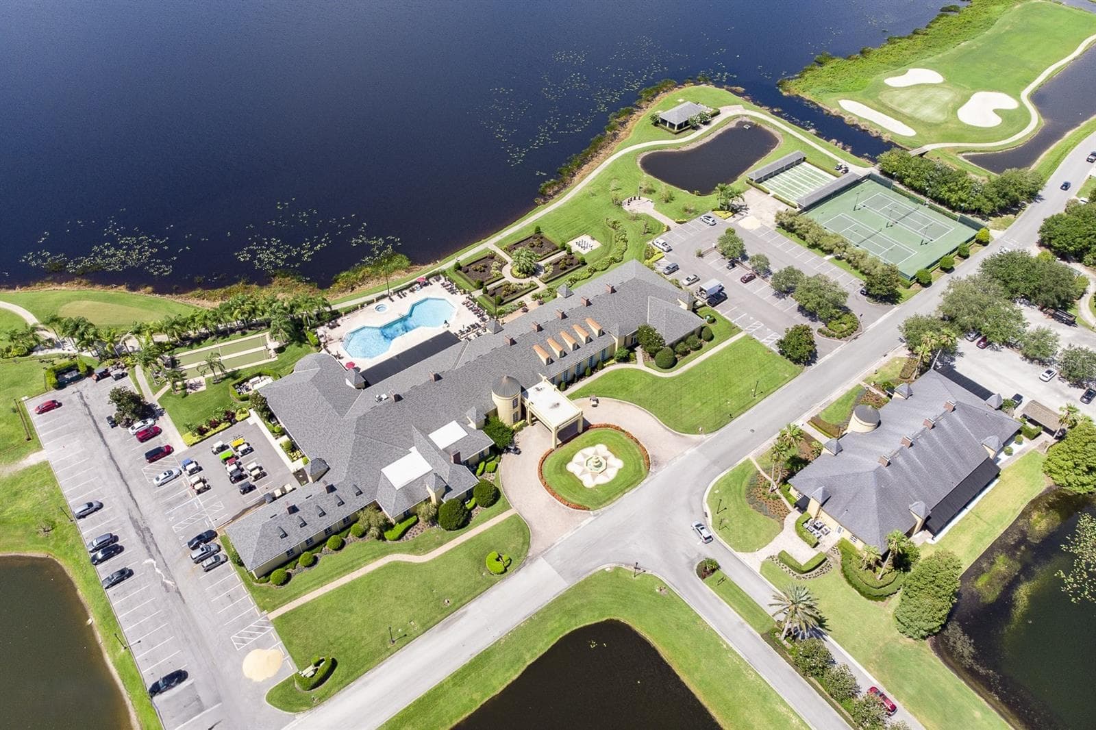 The main clubhouse grounds have lighted tennis and shuffleboard courts, basketball, horseshoe pits, English garden, heated pool and spa, bocce/lawn bowling, a community gazebo and a veteran's memorial. - 4360 ASHTON CLUB DR, LAKE WALES