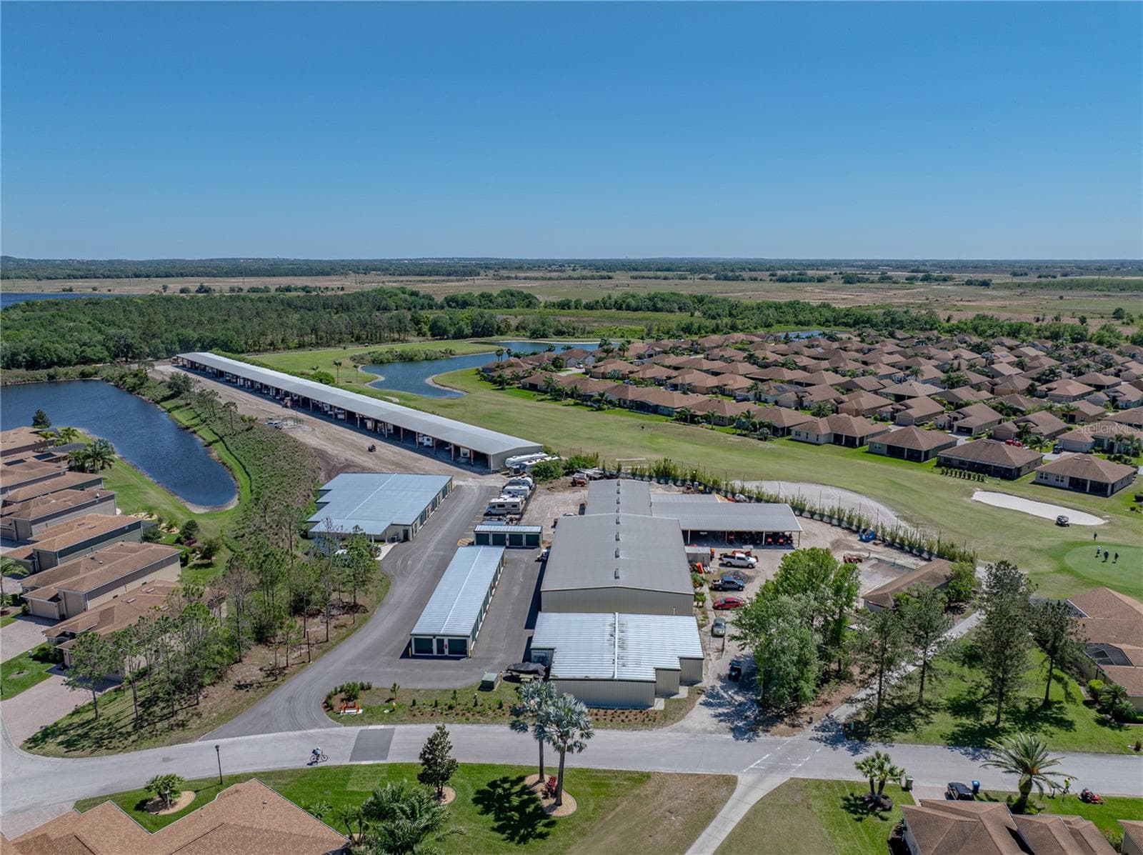 Inside Lake Ashton is a storage facility where residents can find covered and open RV, boat, and trailer storage. Regular and climate controlled storage can also be rented. - 4360 ASHTON CLUB DR, LAKE WALES